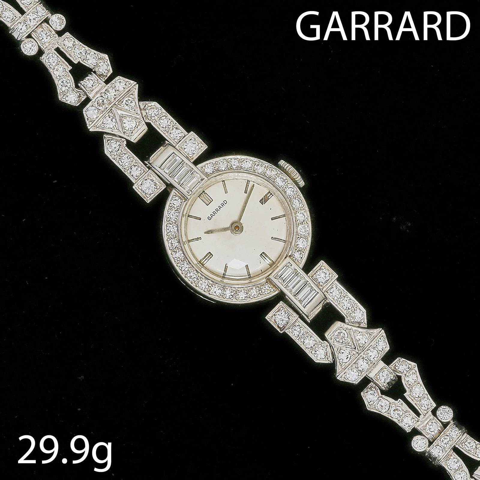 GARRARD, ART-DECO DIAMOND WRISTWATCH: GARRARD, ART-DECO DIAMOND WRISTWATCH,29.9 grams, testing platinum.Bright and lively diamonds on the watch and entire strap, totalling approx. 3.50 ct.L. 15 cm.