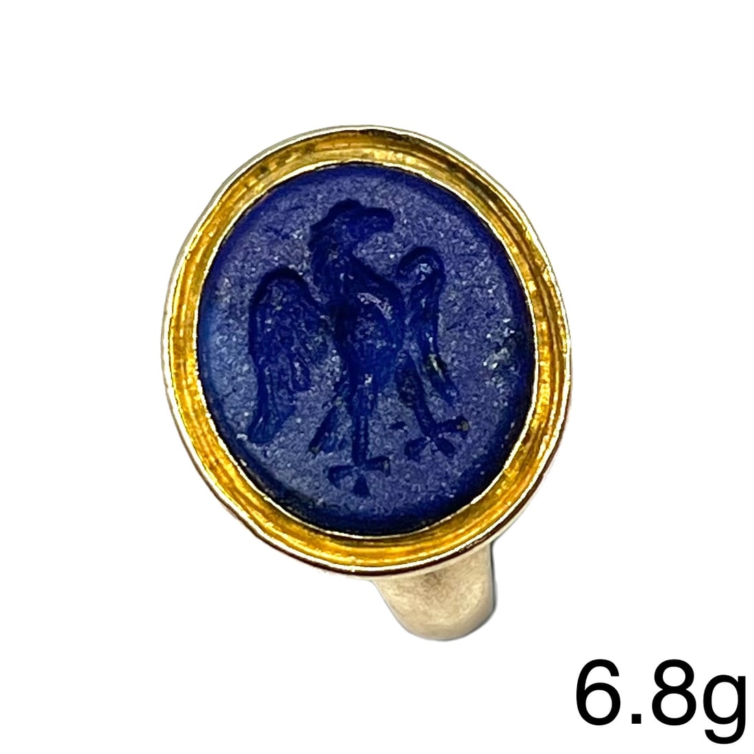 UNUSUAL LAPIS LAZULI INTAGLIO GOLD SEAL RING: UNUSUAL LAPIS LAZULI INTAGLIO GOLD SEAL RING,6.8 grams.Fine carved lapis lazuli intaglio in Roman setting, depicting an eagle.Size M.