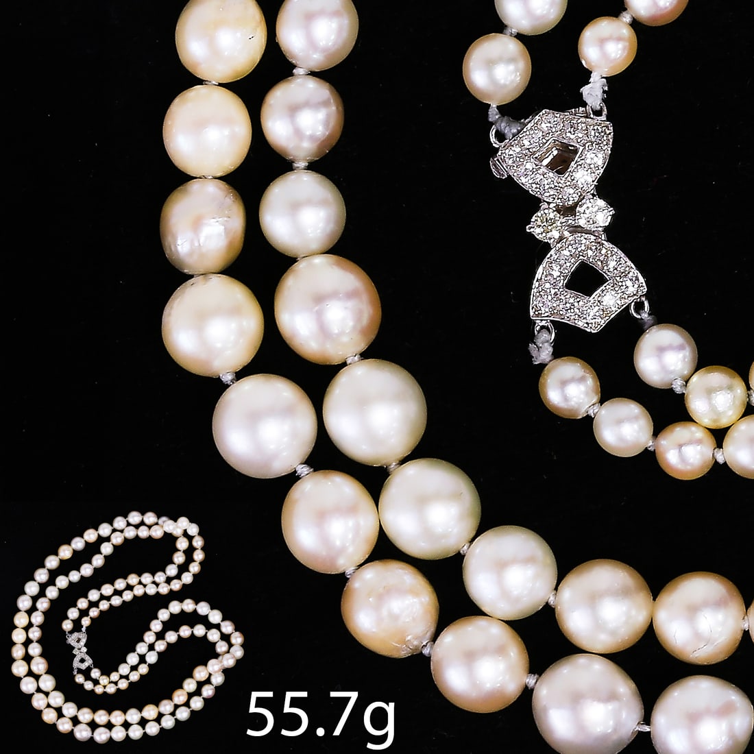 TWO STRAND PEARL NECKLACE WITH DIAMOND CLASP: TWO STRAND PEARL NECKLACE WITH DIAMOND CLASP 55.7 grams 18 ct gold diamond clasp pearls well matched (untested).L 42 cm