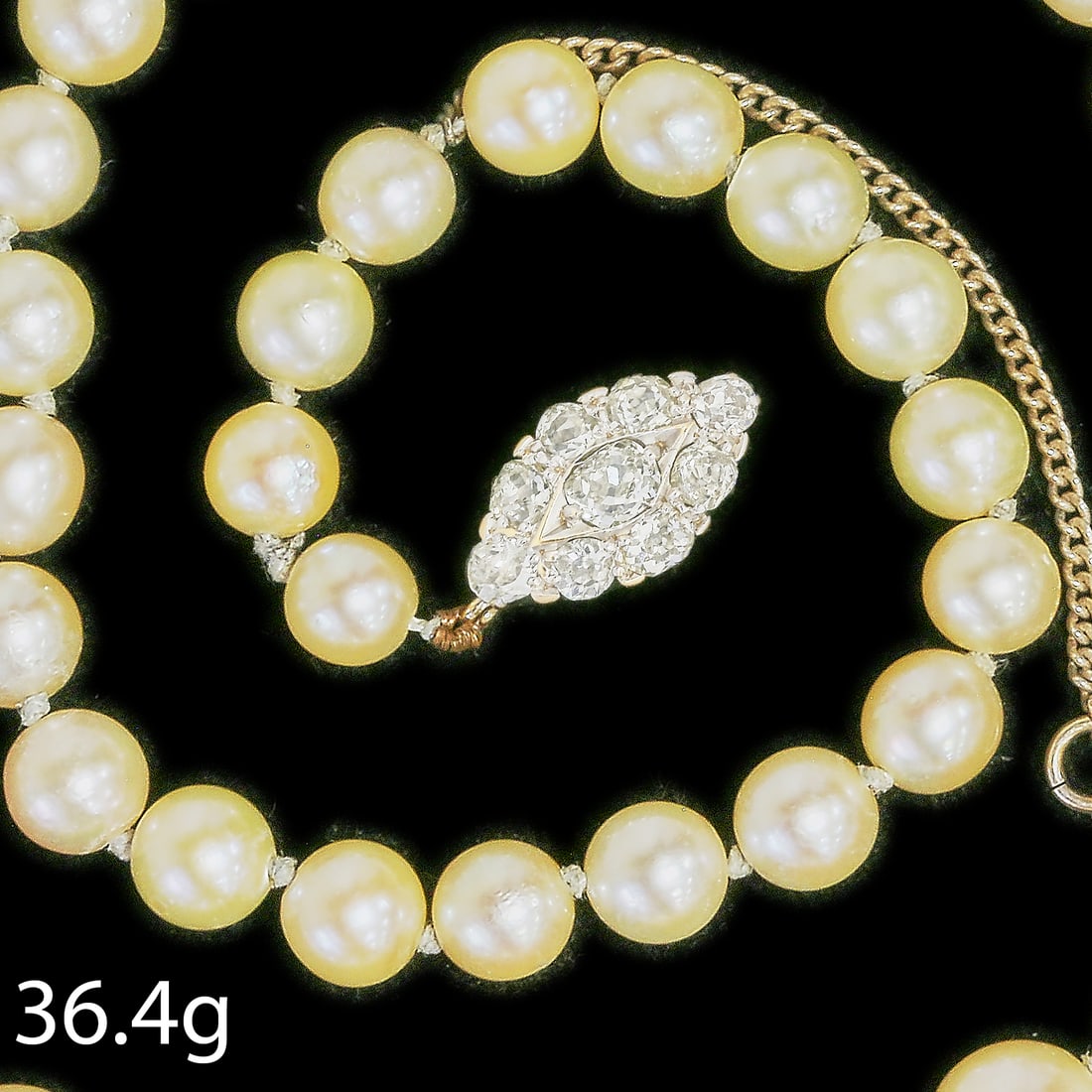 PEARL AND DIAMOND NECKLACE: PEARL AND DIAMOND NECKLACE,36,4 grams.Fine diamond clasp, totalling approx. 1 ct.Largest pearl of approx. 8.4 mm. (untested).L. 56 cm.