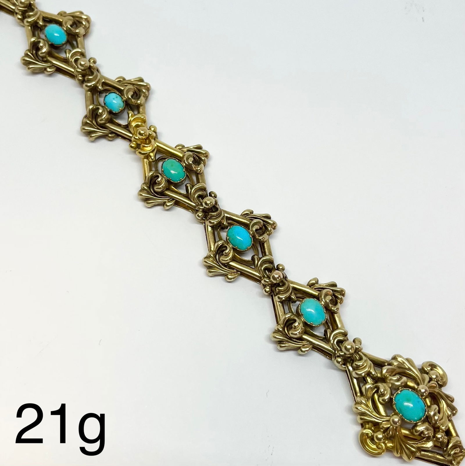 VICTORIAN TURQUOISE BRACELET: VICTORIAN TURQUOISE BRACELET,21 grams, testing high carat gold.Vibrant turquoise.The links with lovely relief decoration.L., 19.5 cm.