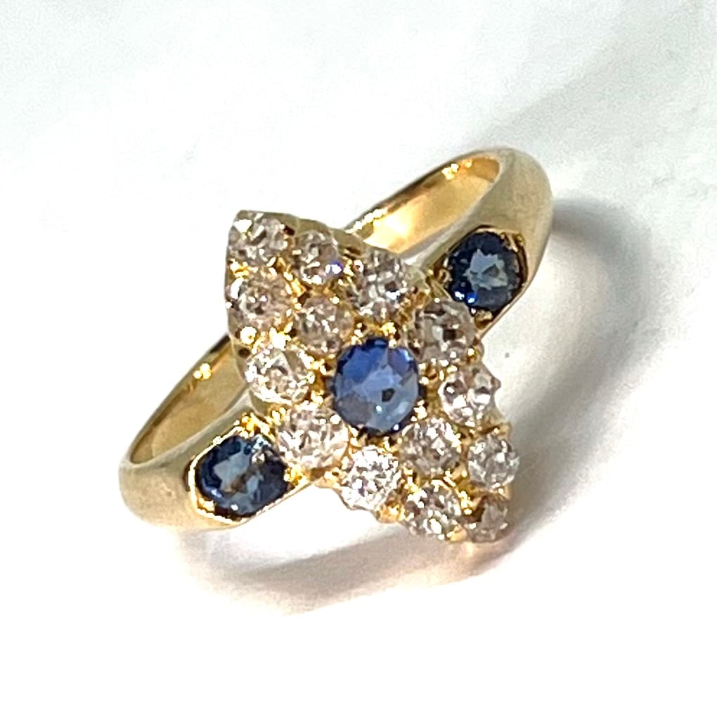 SAPPHIRE AND DIAMOND MARQUISE SHAPED RING: SAPPHIRE AND DIAMOND MARQUISE SHAPED RING,testing high carat gold.Bright and lively old cut diamonds.Vibrant sapphires.Size I.