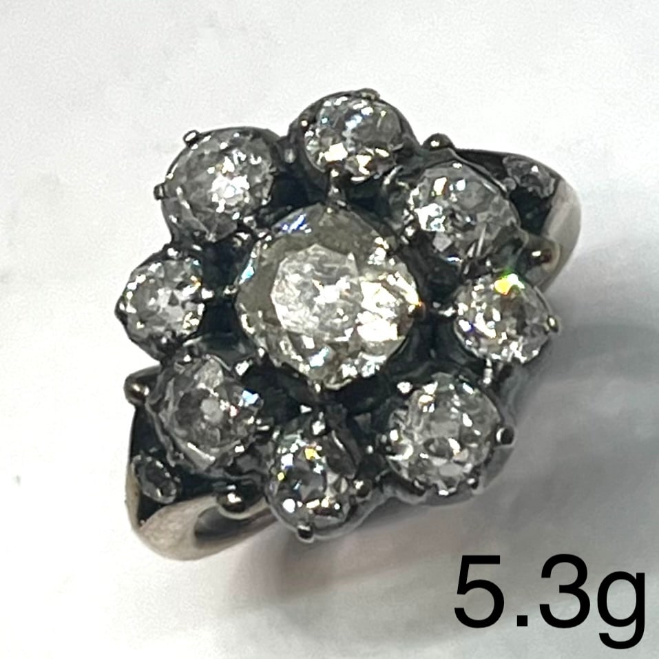 ANTIQUE DIAMOND CLUSTER RING: ANTIQUE DIAMOND CLUSTER RING,5,3 grams testing high carat gold and silver.Fine old cut central diamond of approx. 0.95 ct.Diamonds totalling approx. 3.20 ct.Size N.