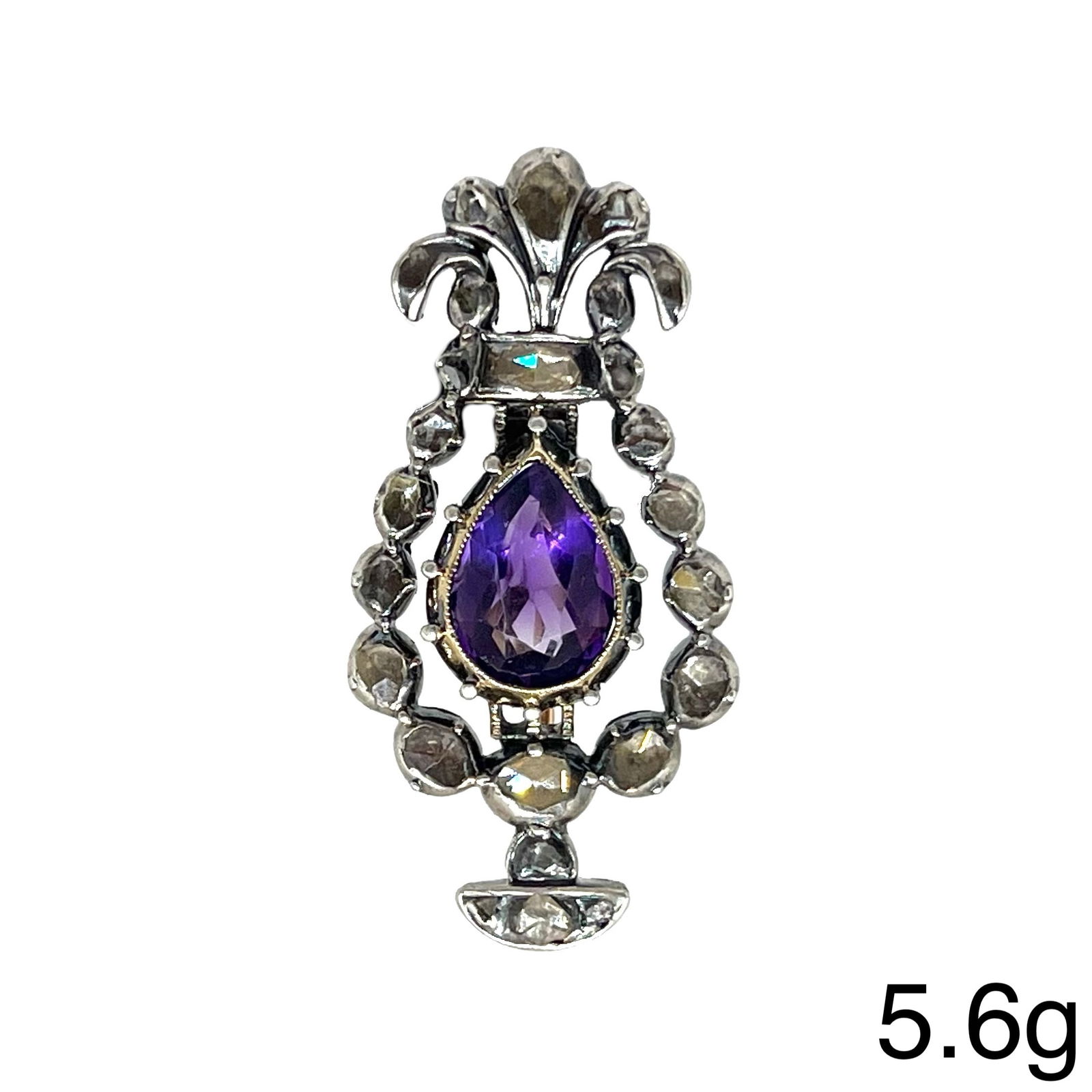 ANTIQUE AMETHYST AND DIAMOND BROOCH: ANTIQUE AMETHYST AND DIAMOND BROOCH,5,6 grams, gold backed.Of stylized floral design.Rich and vibrant amethyst.Diamonds bright and lively.L. 3.7 cm.