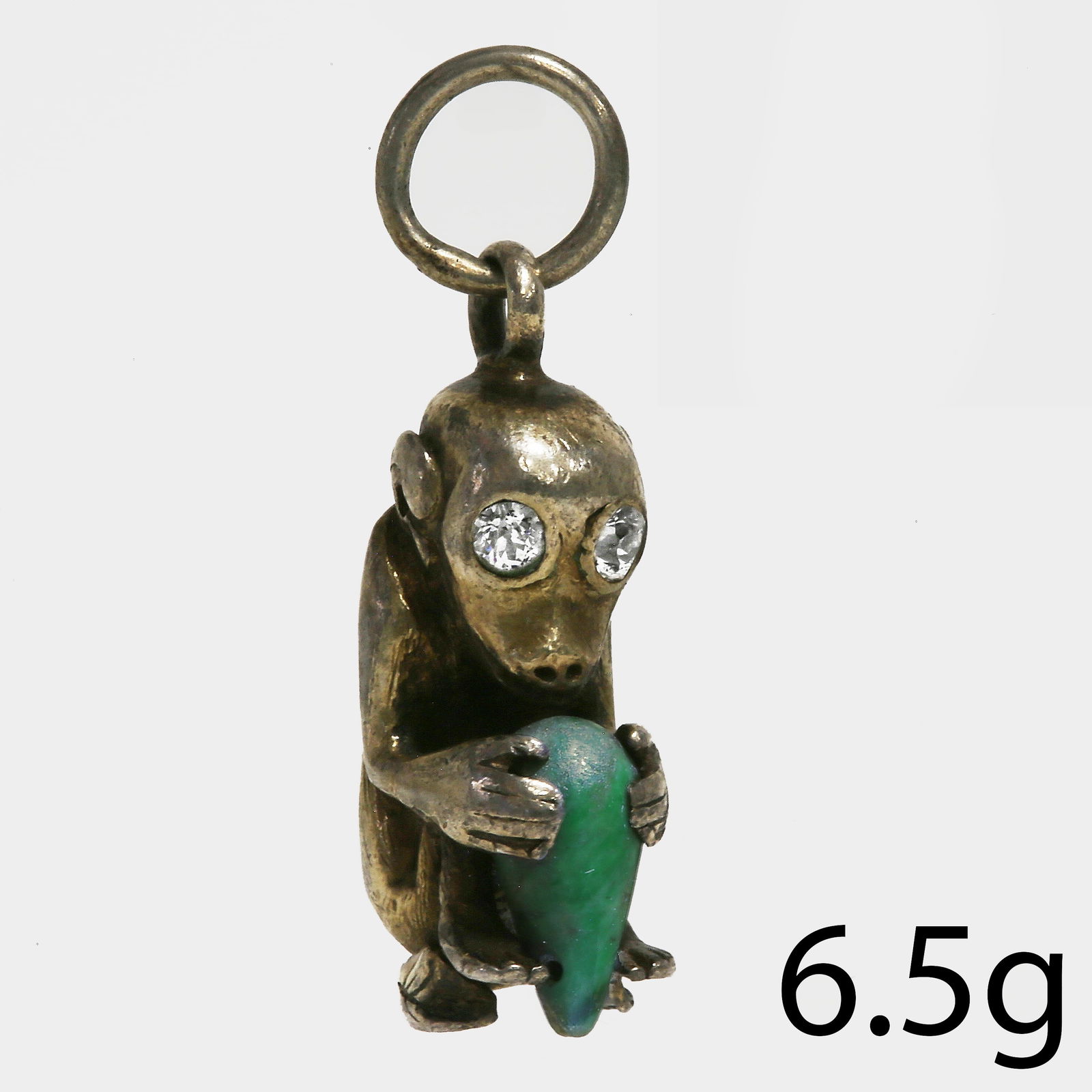 CHINESE JADE AND DIAMOND MONKEY CHARM PENDANT: CHINESE JADE AND DIAMOND MONKEY CHARM PENDANT,6.5 grams.Diamonds bright and lively.L. 2.7 cm.