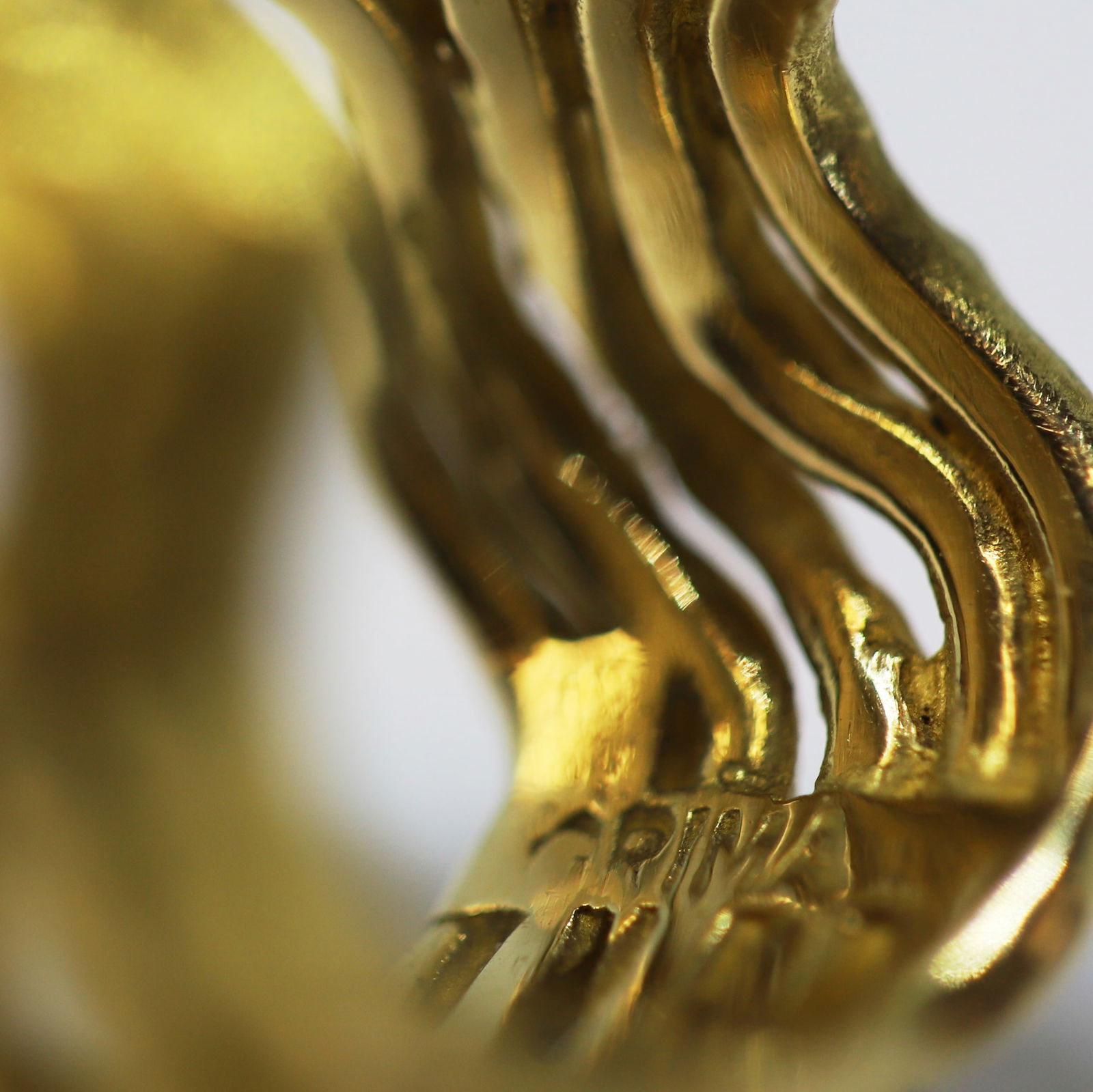 ANDREW GRIMA, MODERNIST OPAL RING: ANDREW GRIMA, MODERNIST OPAL RING,14 grams, 18 ct. gold.The ring of 5-band wave design, set with an opal with great play of colour.Signed Grima and makers mark.Size O 1/2