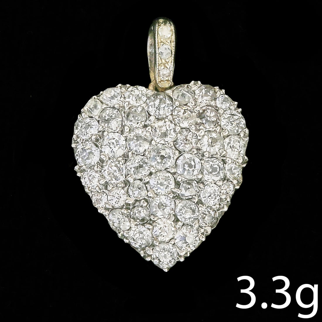 DIAMOND HEART PENDANT: DIAMOND HEART PENDANT,2,8 grams, testing high carat gold.Diamonds bright and livley.L. 2,4 cm.