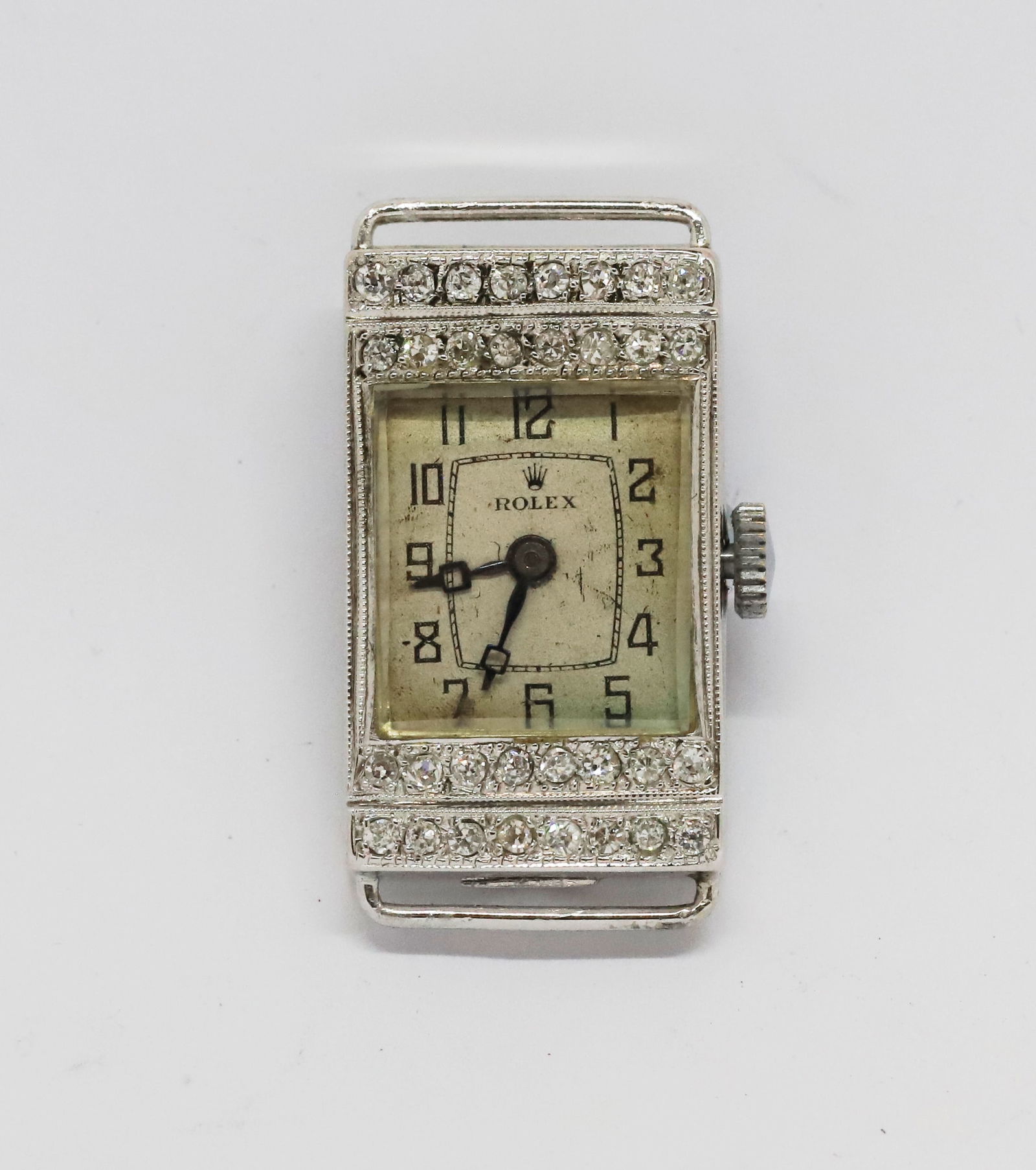UNUSUAL ROLEX DIAMOND WATCH, CA. 1930'S: UNUSUAL ROLEX DIAMOND WATCH, CA. 1930'S.11.1 grams, case 18 ct. gold.Diamonds bright and lively.15 jewels movement.Dial signed Rolex.L. 2.8 cm.