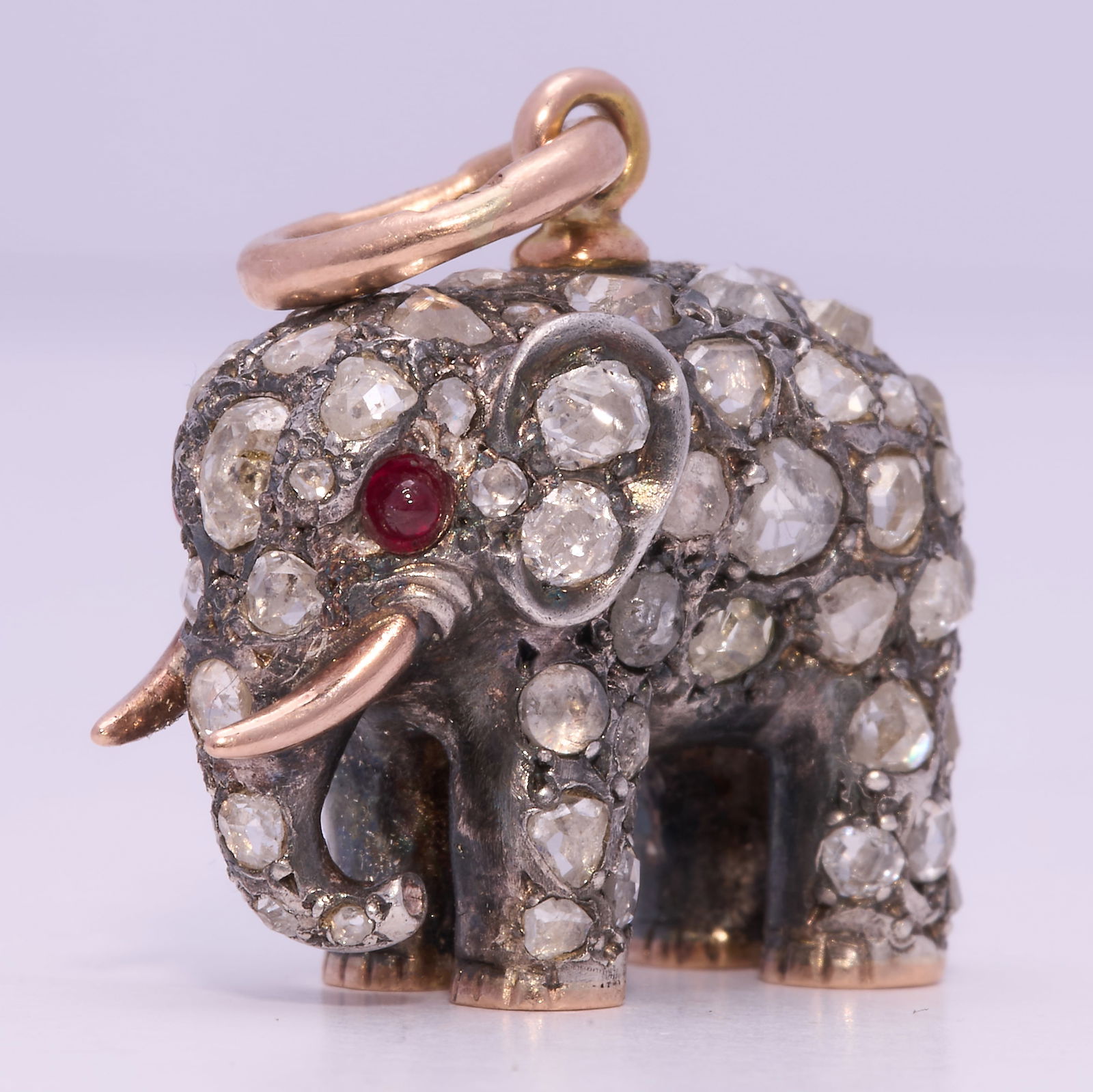 ERIK KOLLIN (, RARE DIAMOND AND RUBY ELEPHANT PENDANT,: ERIK KOLLIN (, RARE DIAMOND AND RUBY ELEPHANT PENDANT,11 gram, 56 zolotnik, St. Petersburg.The elephant shaped in great detail, with bright and lively rose cut diamonds.2 ruby eyes.Fine shaped