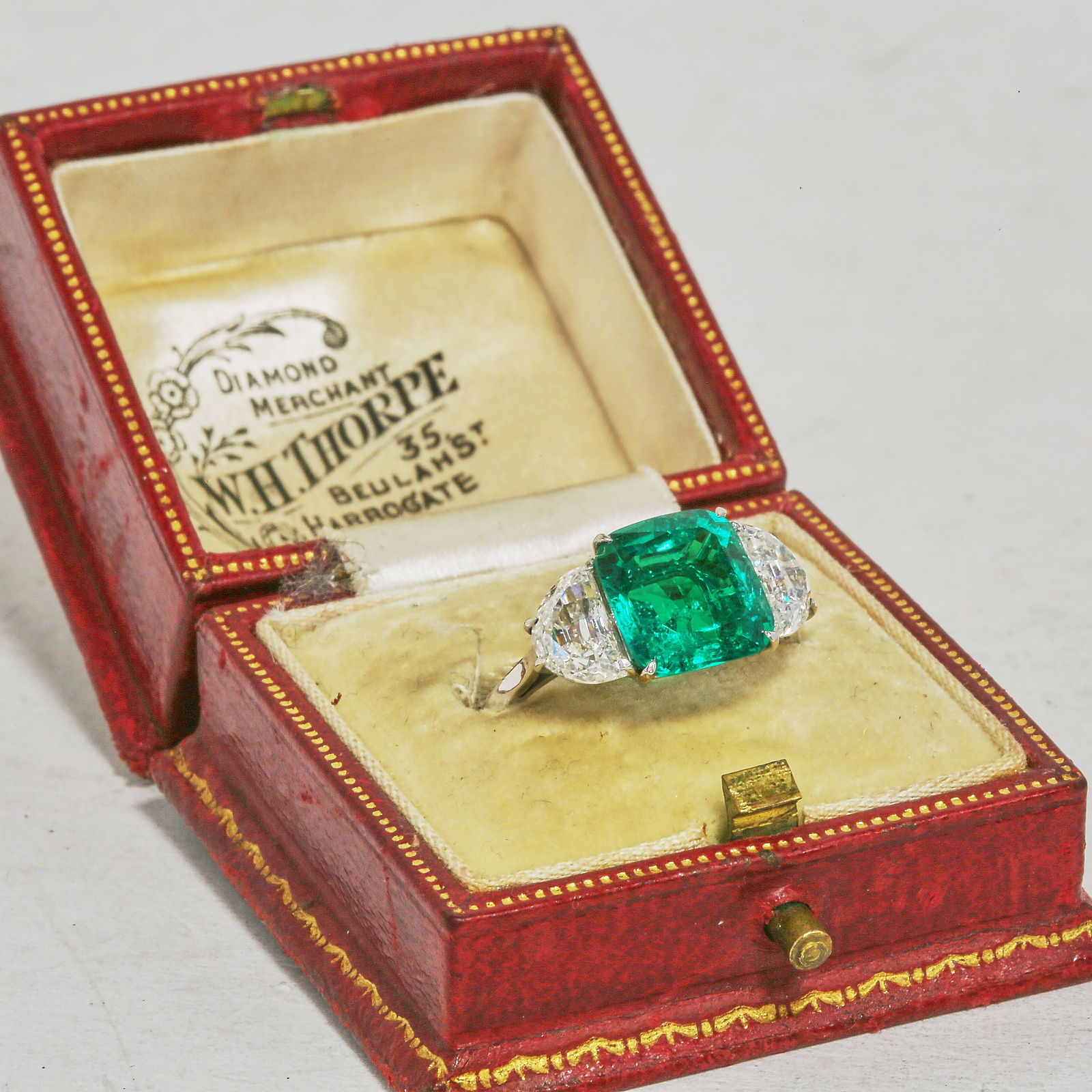 FANTASTIC CERTIFICATED 3.24 CT. COLOMBIAN EMERALD AND DIAMOND 3-STONE RING: FANTASTIC CERTIFICATED 3.24 CT. COLOMBIAN EMERALD AND DIAMOND 3-STONE RING,Testing platinum.Rich and vibrant emerald, 0f approx. 3.24 ct. (Certificated, Colombian, Minor.).On each side a half moon