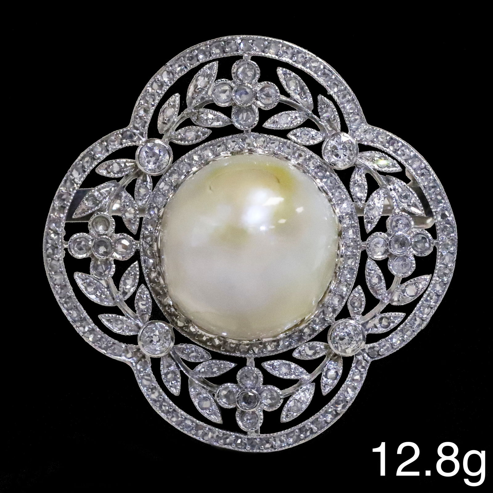 FANTASTIC BELLE EPOQUE CERTIFICATED NATURAL SALTWATER PEARL AND DIAMOND BROOCH: FANTASTIC BELLE EPOQUE CERTIFICATED NATURAL SALTWATER PEARL AND DIAMOND BROOCH,12.8 grams, testing platinum.Fine and large natural saltwater pearl of approx. 14,66 x 14,03 x 10,19 mm. 14,28 ct.