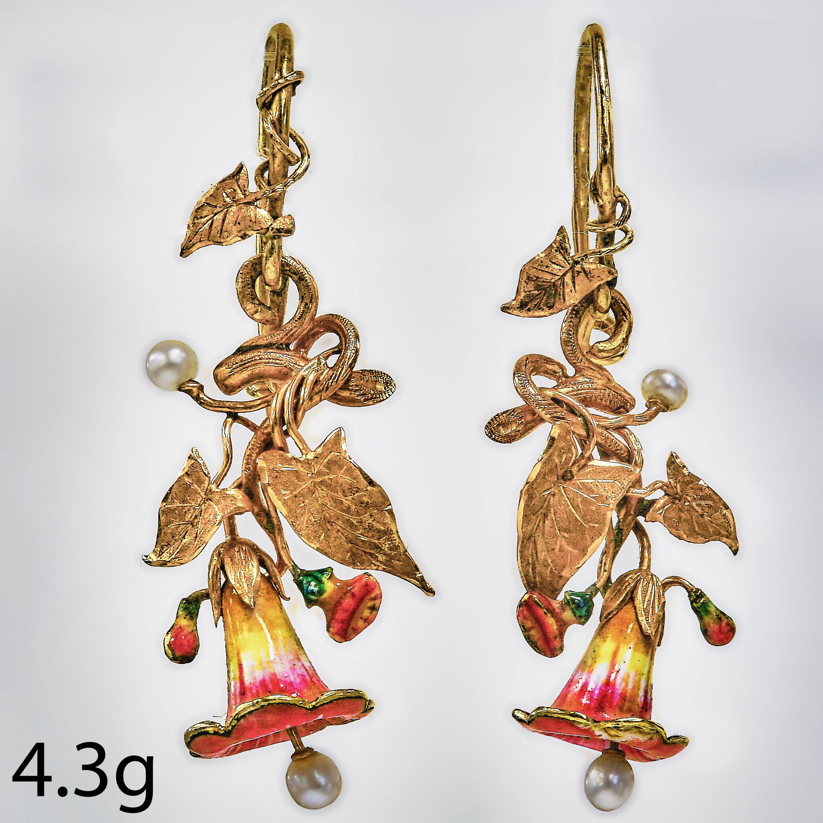 LOVELY AND UNUSUAL PAIR OF VICTORIAN ENAMEL FLORAL EARRINGS: LOVELY AND UNUSUAL PAIR OF VICTORIAN ENAMEL FLORAL EARRINGS,4,3 grams, testing high carat gold.The floral drop with fine multi colour enamel, suspending a pearl drop to the centre.L. 3.8 cm.