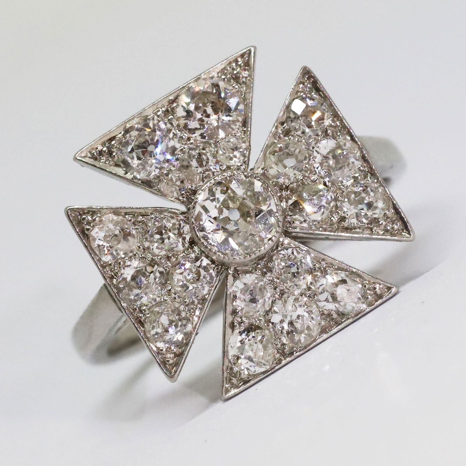 DIAMOND MALTESE CROSS RING: DIAMOND MALTESE CROSS RING,4,7 grams, testing platinum.Bright and lively old cut diamonds, totalling approx. 2.40 ct.Size R.