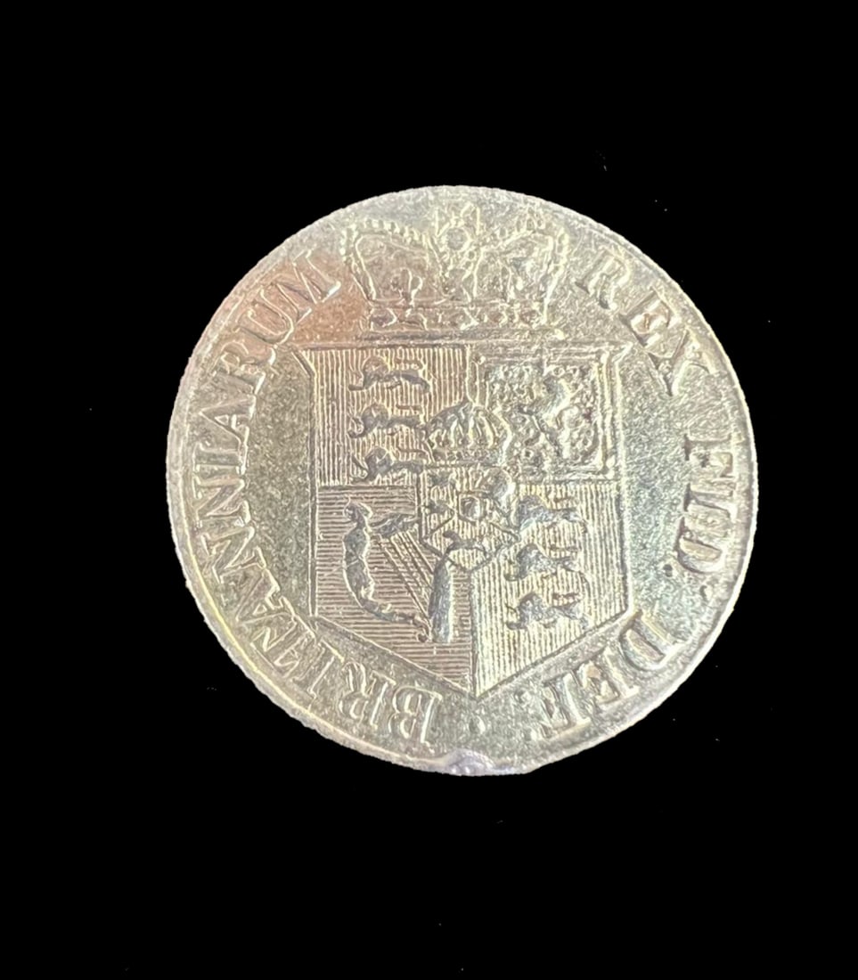 1817 Gold Half Sovereign.: 1817 Gold Half Sovereign.3.9 grams, 22ct gold. Laureate head of George III right; reverse crowned shield of arms within garter. First year of the modern half sovereign issue following the Great