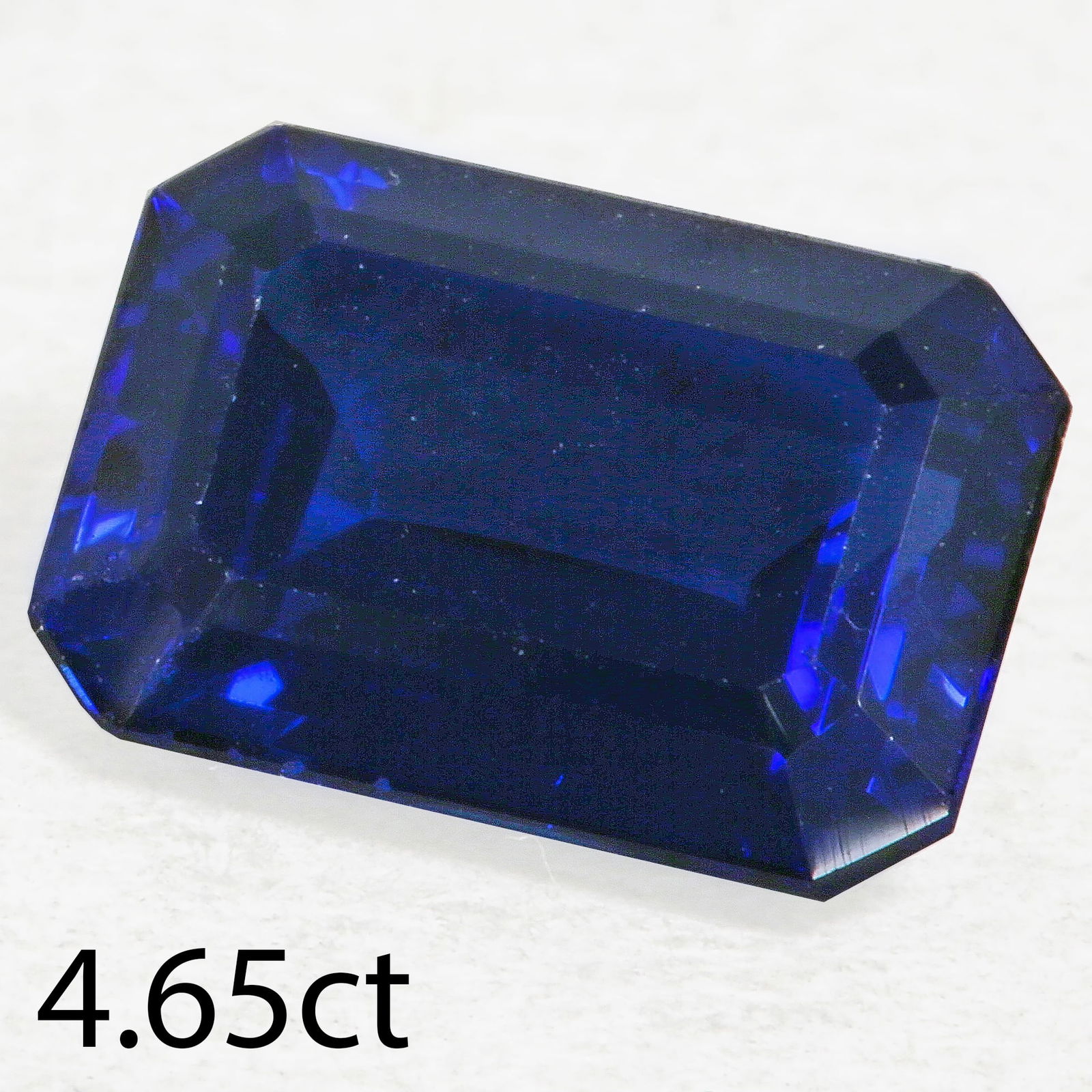 LOOSE CUT BLUE STONE, APPROX 4.65 CT.: LOOSE CUT BLUE STONE, APPROX 4.65 CT.Likely synthetic sapphire.