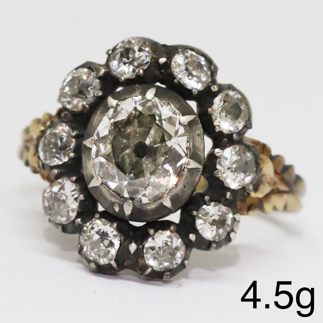 ANTIQUE DIAMOND CLUSTER RING: ANTIQUE DIAMOND CLUSTER RING,4,5 grams, testing high carat gold and silver.Bright and lively old cut diamonds, totalling approx. 1.75 ct.Size N.
