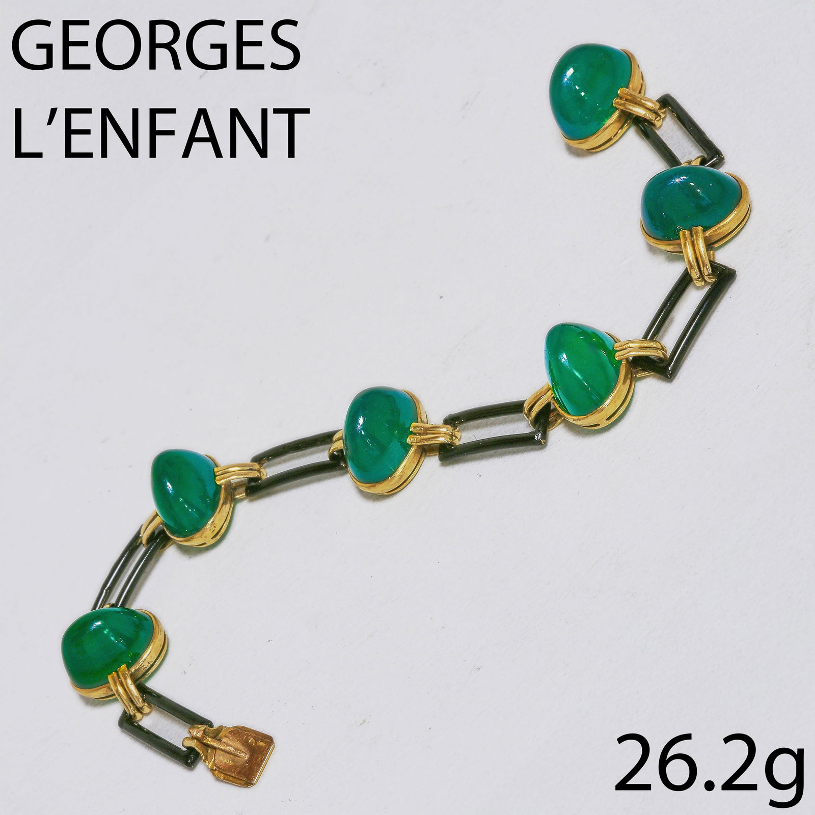 GEORGES LENFANT, FINE CHALCEDONY AND LACQUER BRACELET: GEORGES LENFANT, FINE CHALCEDONY AND LACQUER BRACELET,26,2 grams, 18 ct. gold, French marked.6 fine chalcedony cabochons, each separated with links decorated with lacquer.Makers mark GL for Georges Le