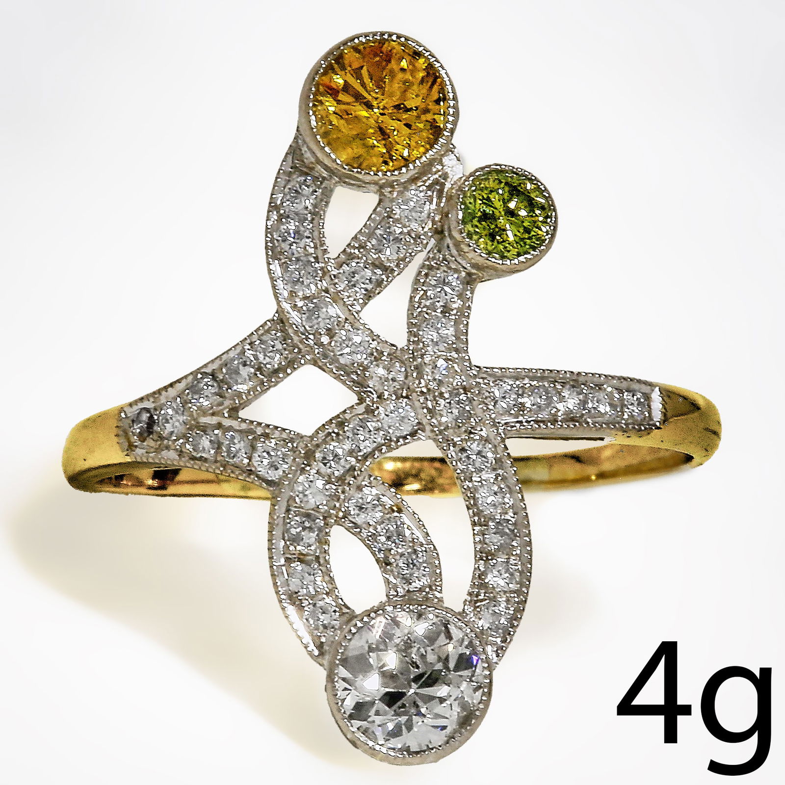 ELEGANT ART DECO DIAMOND AND FANCY COLOURED DIAMOND RING: ELEGANT ART DECO DIAMOND AND FANCY COLOURED DIAMOND RING 4 grams high carat gold and platinum bright lively diamonds in great condition fine craftsmanship size V