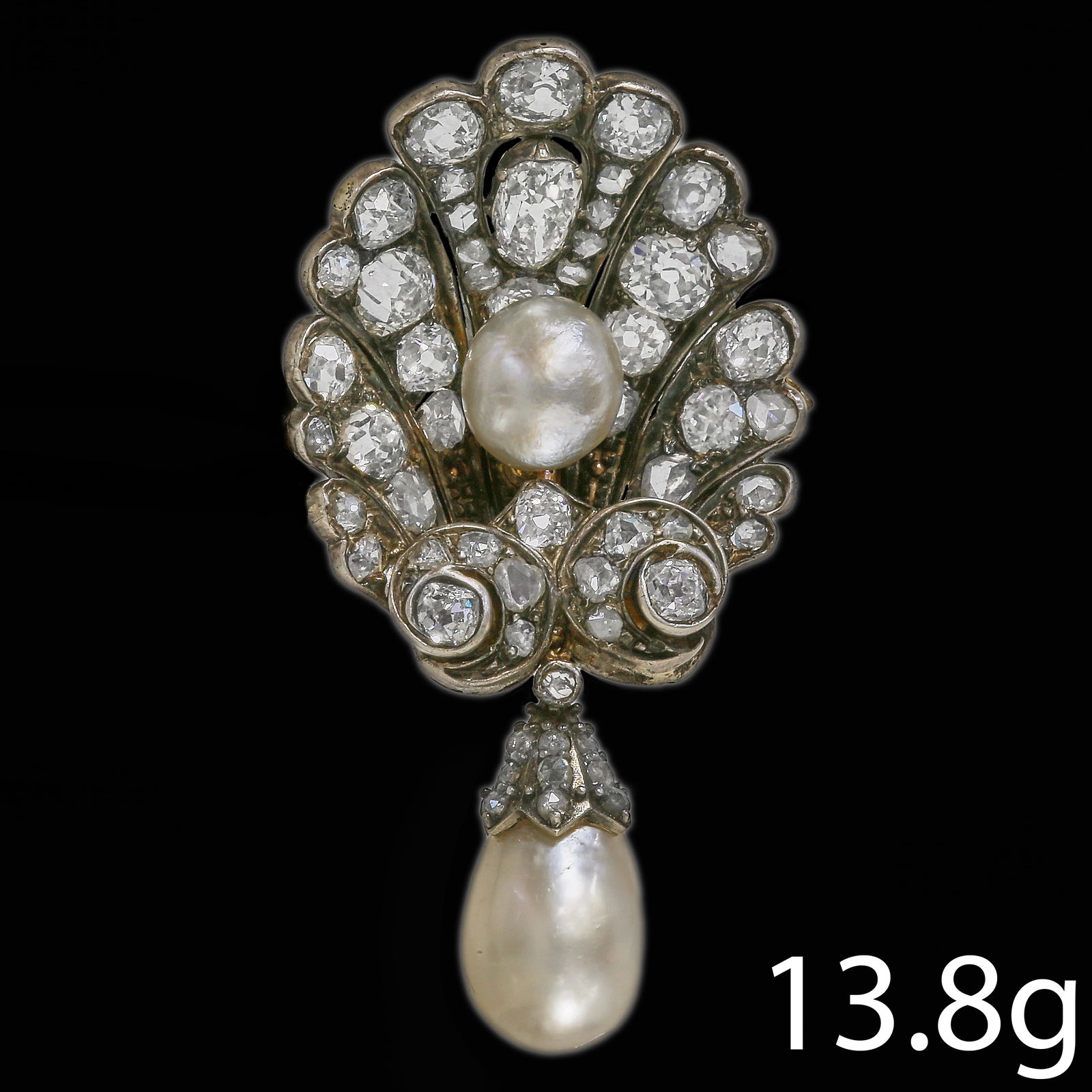 MAGNIFICENT CERTIFICATED NATURAL SALTWATER PEARL AND DIAMOND SHELL BROOCH: MAGNIFICENT CERTIFICATED NATURAL SALTWATER PEARL AND DIAMOND SHELL BROOCH A fine antique natural saltwater pearl and diamond brooch, of fan-shaped design set throughout with old-cut diamonds in silver
