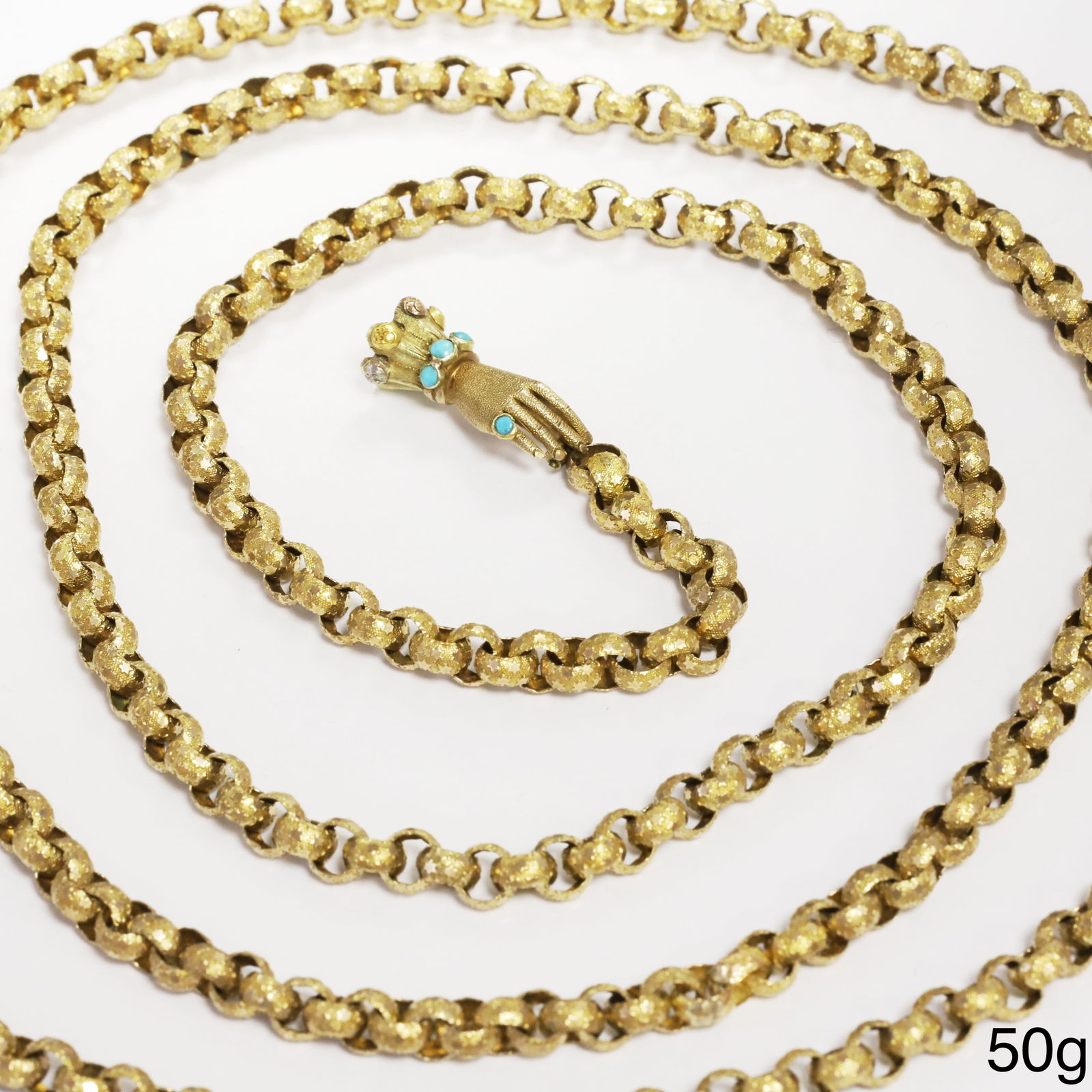 LOVELY GEORGIAN BELCHER LINK GUARD CHAIN NECKLACE WITH HAND CLASP: LOVELY GEORGIAN BELCHER LINK GUARD CHAIN NECKLACE WITH HAND CLASP,50 grams, testing high carat gold.The links with fine relief decoration including stars.The hand clasp set with turquoise.L. 126 cm.