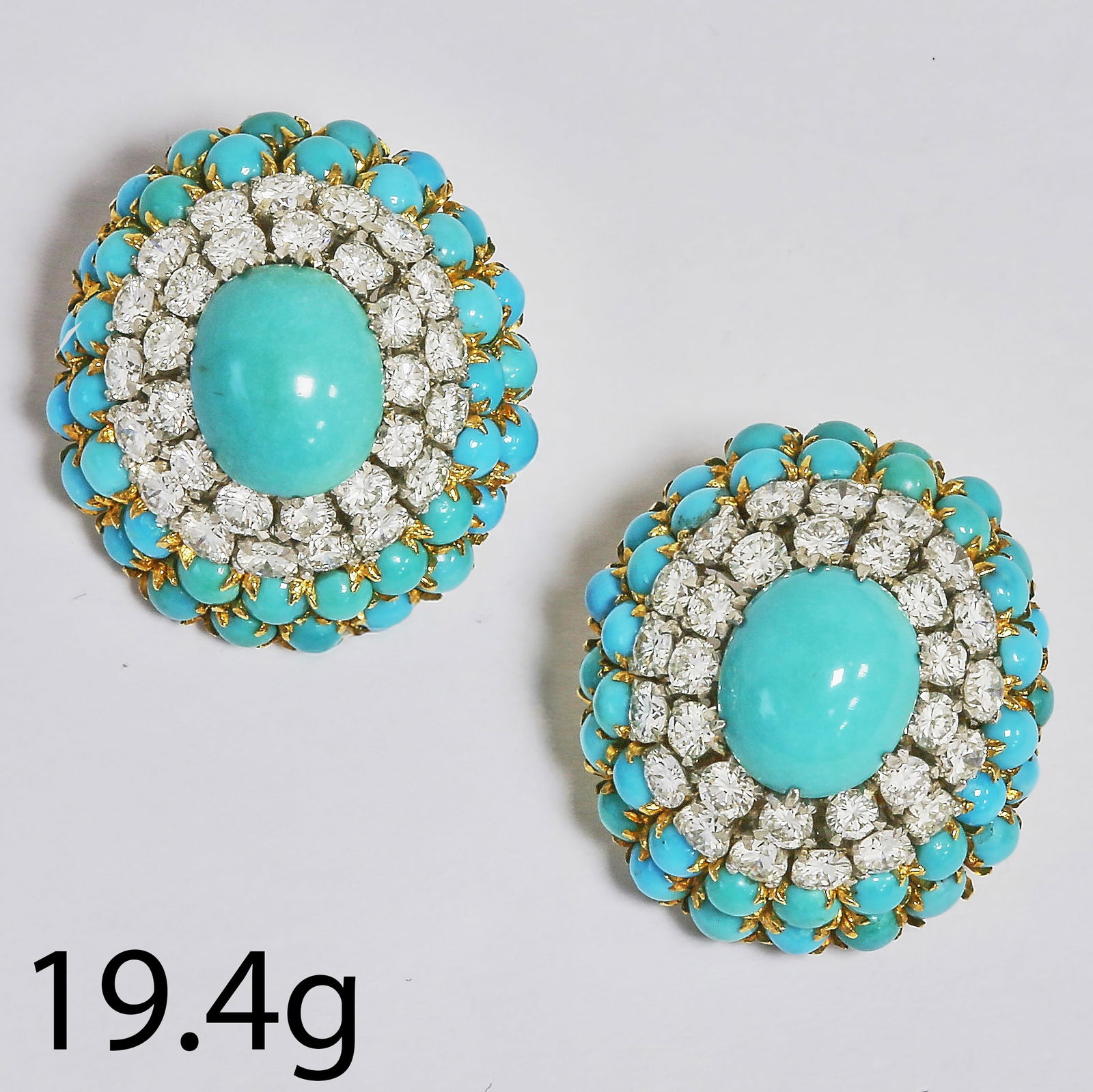 PAIR OF TURQUOISE AND DIAMOND CLUSTER EARRINGS: PAIR OF TURQUOISE AND DIAMOND CLUSTER EARRINGS,19.4 grams, testing high carat gold.Rich and vibrant turquoise.Diamonds bright and lively, totalling approx. 2.50 ct.L. 2.3 cm.