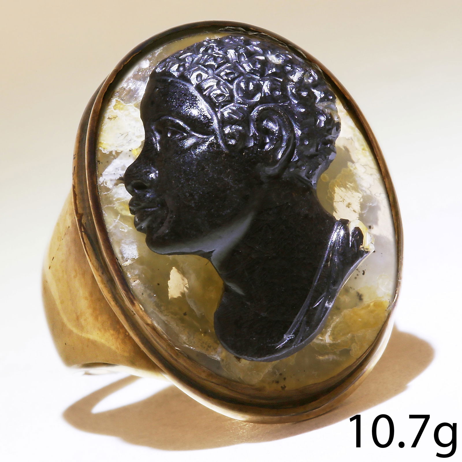 ANTIQUE HARDSTONE CAMEO RING: ANTIQUE HARDSTONE CAMEO RING,10.7 grams, testing high carat gold.Fine carved cameo in high relief depicting a 'blackamoor'.Size M 1/2.