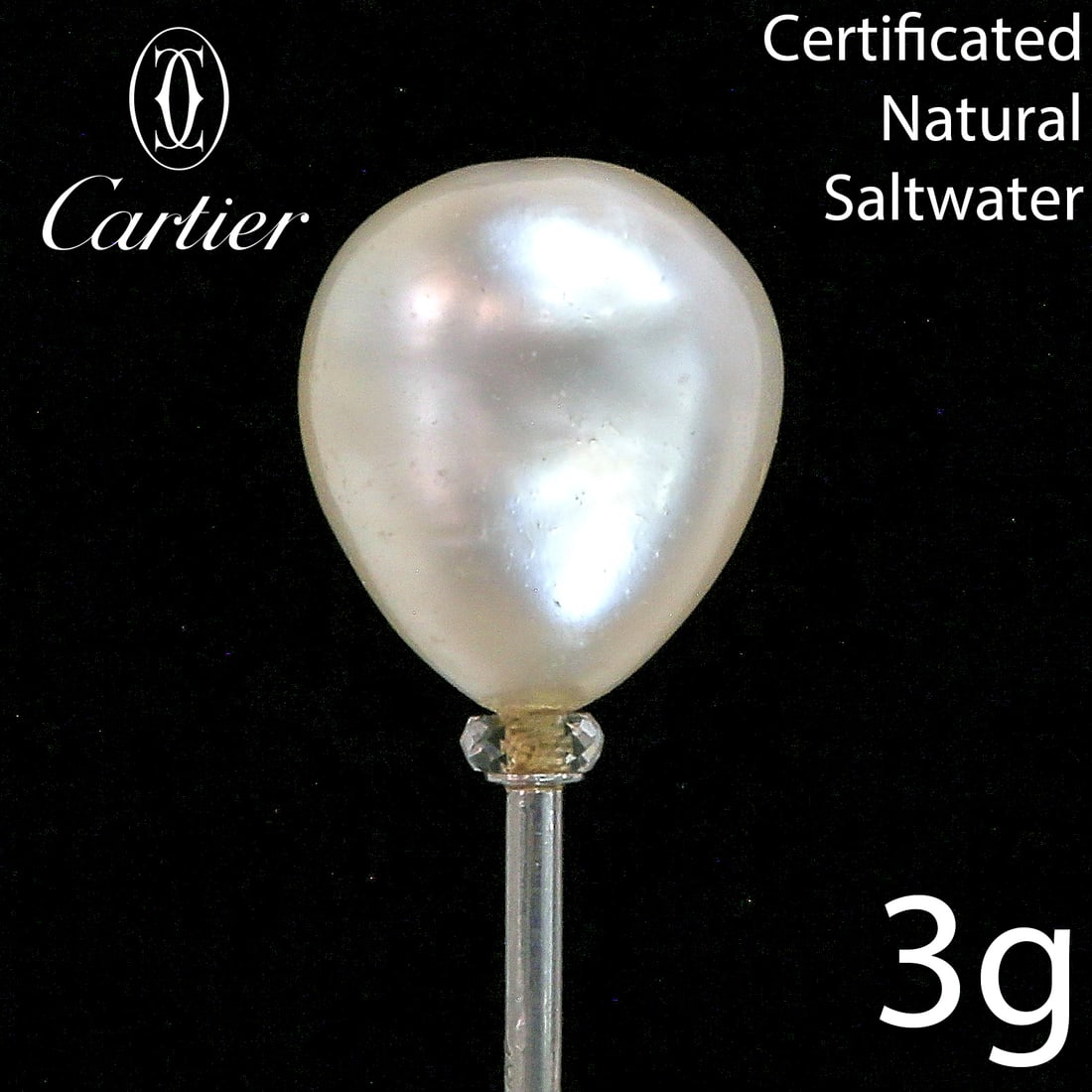 CARTIER, A MAGNIFICENT NATURAL SALTWATER PEARL STICKPIN: CARTIER, A MAGNIFICENT NATURAL SALTWATER PEARL STICKPIN,Large natural saltwater pearl of approx. 12.1 x 10.5 x 9.1 mm. (Certificated Natural Saltwater).Signed Cartier.L. 7.1 cm.See certificate.This