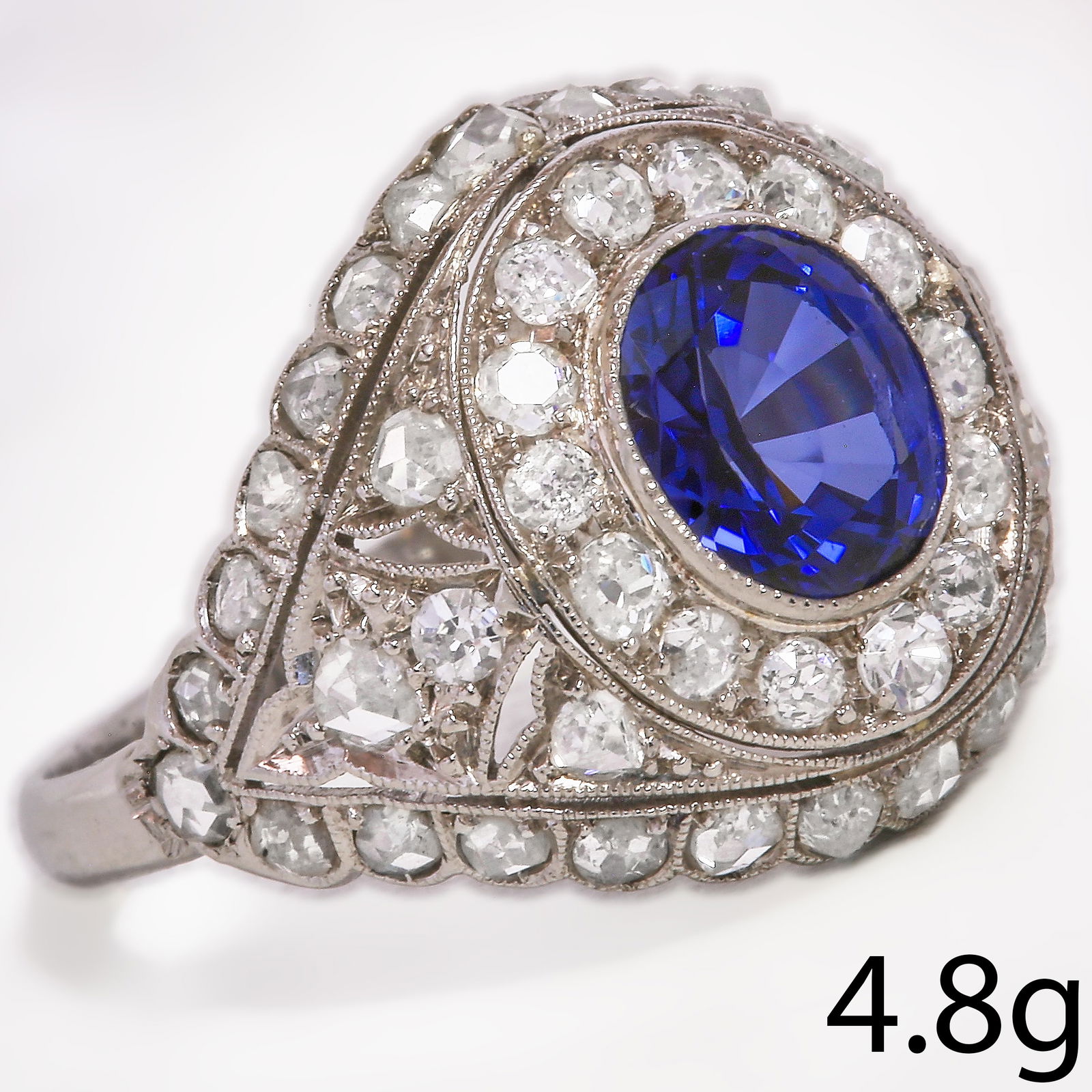 SAPPHIRE AND DIAMOND CLUSTER RING: SAPPHIRE AND DIAMOND CLUSTER RING 4.8 grams high carat gold and platinum rich vibrant sapphire with no abrasions approx 2.47 ct bright lively diamonds approx 1 ct size O fine craftsmanship