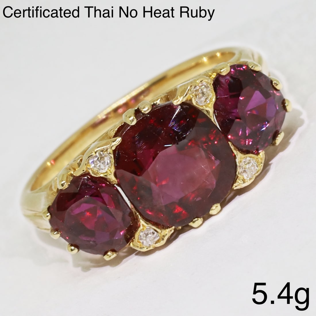 CERTIFICATED FINE RUBY 3-STONE RING: CERTIFICATED FINE RUBY 3-STONE RING,5,4 grams, testing high carat gold.Rich and vibrant rubies, totalling approx. 4.15 ct. (Certificated, Thai, No heat).the rubies of striking colour with a deep red h