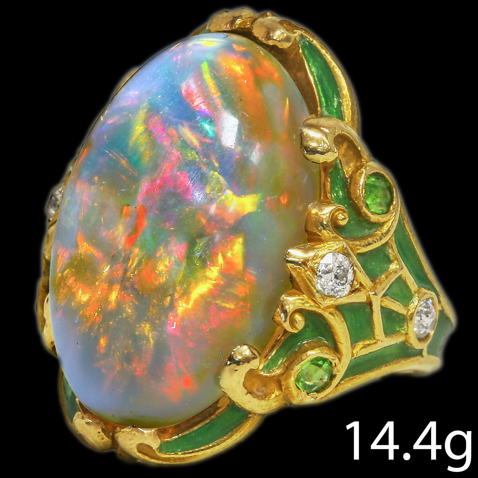 ART-NOUVEAU OPAL, ENAMEL AND DIAMOND RING: ART-NOUVEAU OPAL, ENAMEL AND DIAMOND RING,14.4 grams, 18 ct. gold.Large opal with good play of colour including red, of approx. 13 ct.Diamonds bright and lively.Vibrant green enamel in good condition.