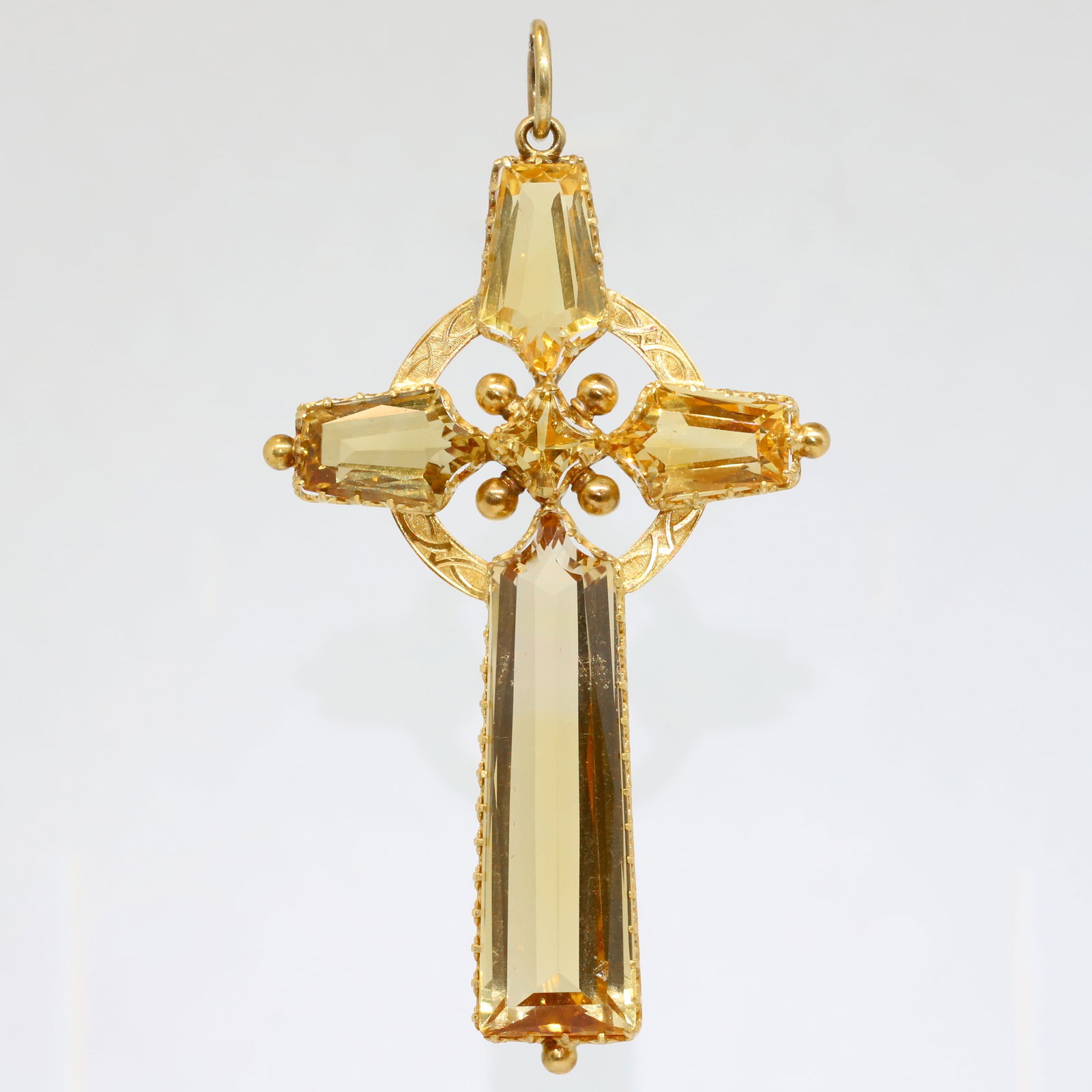 LARGE VICTORIAN CITRINE CROSS PENDANT: LARGE VICTORIAN CITRINE CROSS PENDANT,12.8 grams, testing high carat gold.Rich and vibrant citrines, largest of approx. 38 mm.L. 7.8 cm.