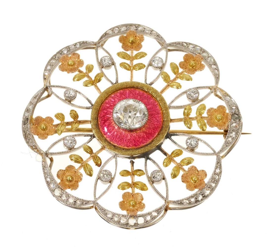 EDWARDIAN ENAMEL AND DIAMOND BROOCH: EDWARDIAN ENAMEL AND DIAMOND BROOCH,15.1 grams, testing high carat gold and platinum.Bright and lively old cut centre diamond of approx. 1.25 ct.The floral accents in lovely multi colour gold.The