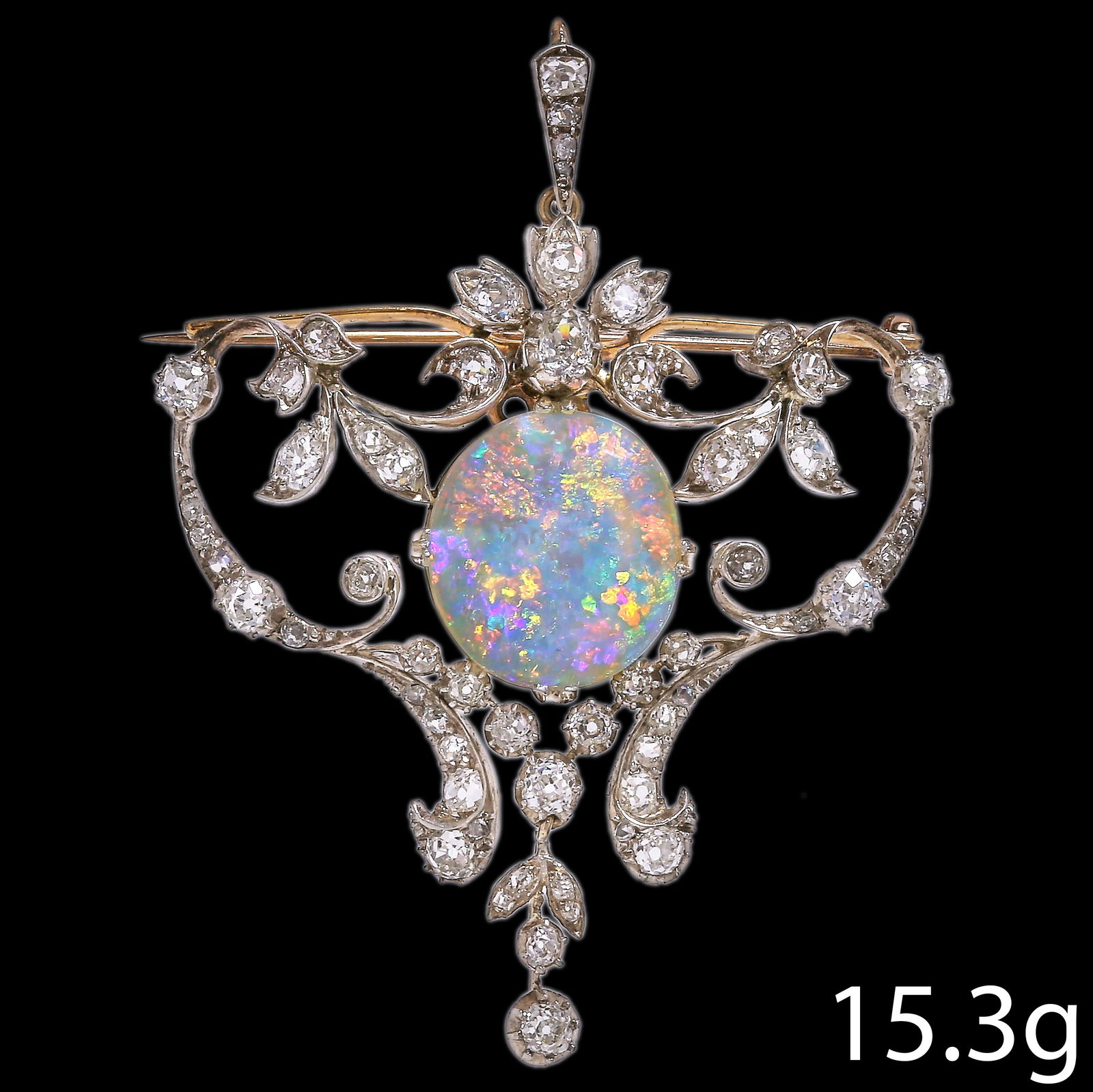 FINE BELLE EPOQUE OPAL AND DIAMOND BROOCH/PENDANT: FINE BELLE EPOQUE OPAL AND DIAMOND BROOCH/PENDANT,15.3 grams, testing high carat gold and silver.Large vibrant opal with great play of colour including red, of approx. 7.12 ct.Diamonds bright and live