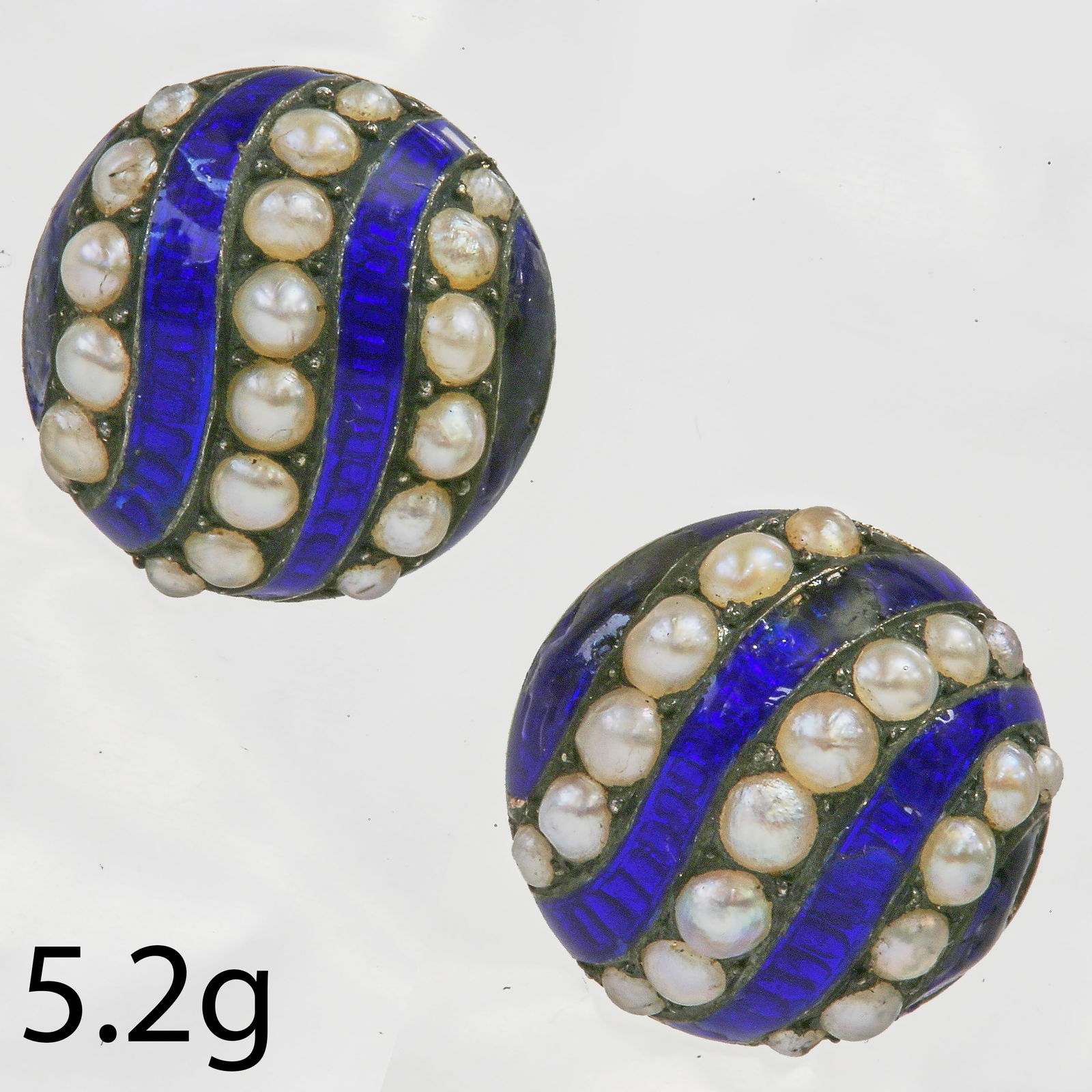 PAIR OF ANTIQUE ENAMEL AND PEARL EARRINGS: PAIR OF ANTIQUE ENAMEL AND PEARL EARRINGS,5,2 grams, testing high carat gold.Part swirl design, alternated with enamel and pearls.Diam. 1,3 cm.