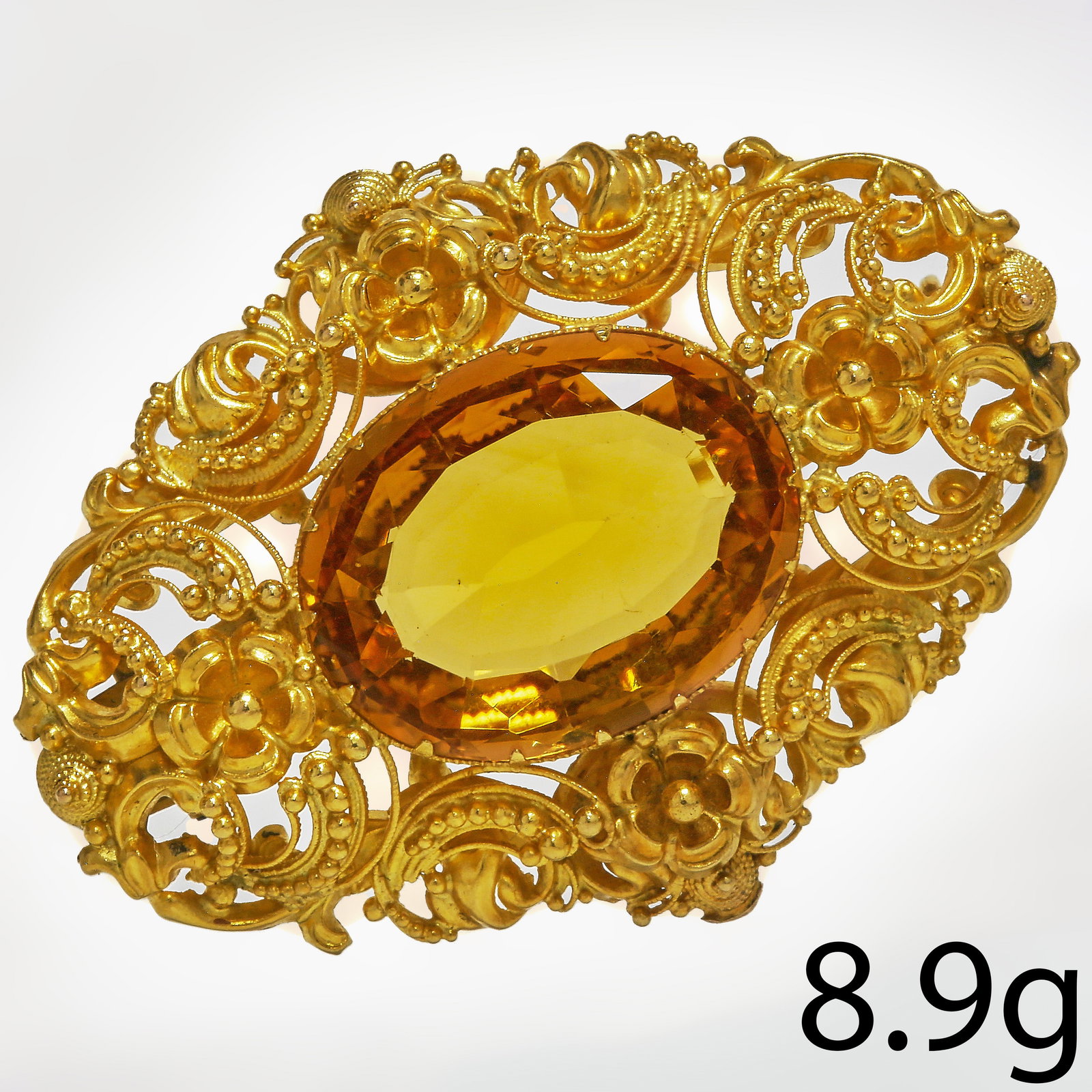 VICTORIAN CITRINE BROOCH: VICTORIAN CITRINE BROOCH,8.9 grams, testing high carat gold.Rich and vibrant citrine of approx. 18.7 mm.W. 4.3 cm.