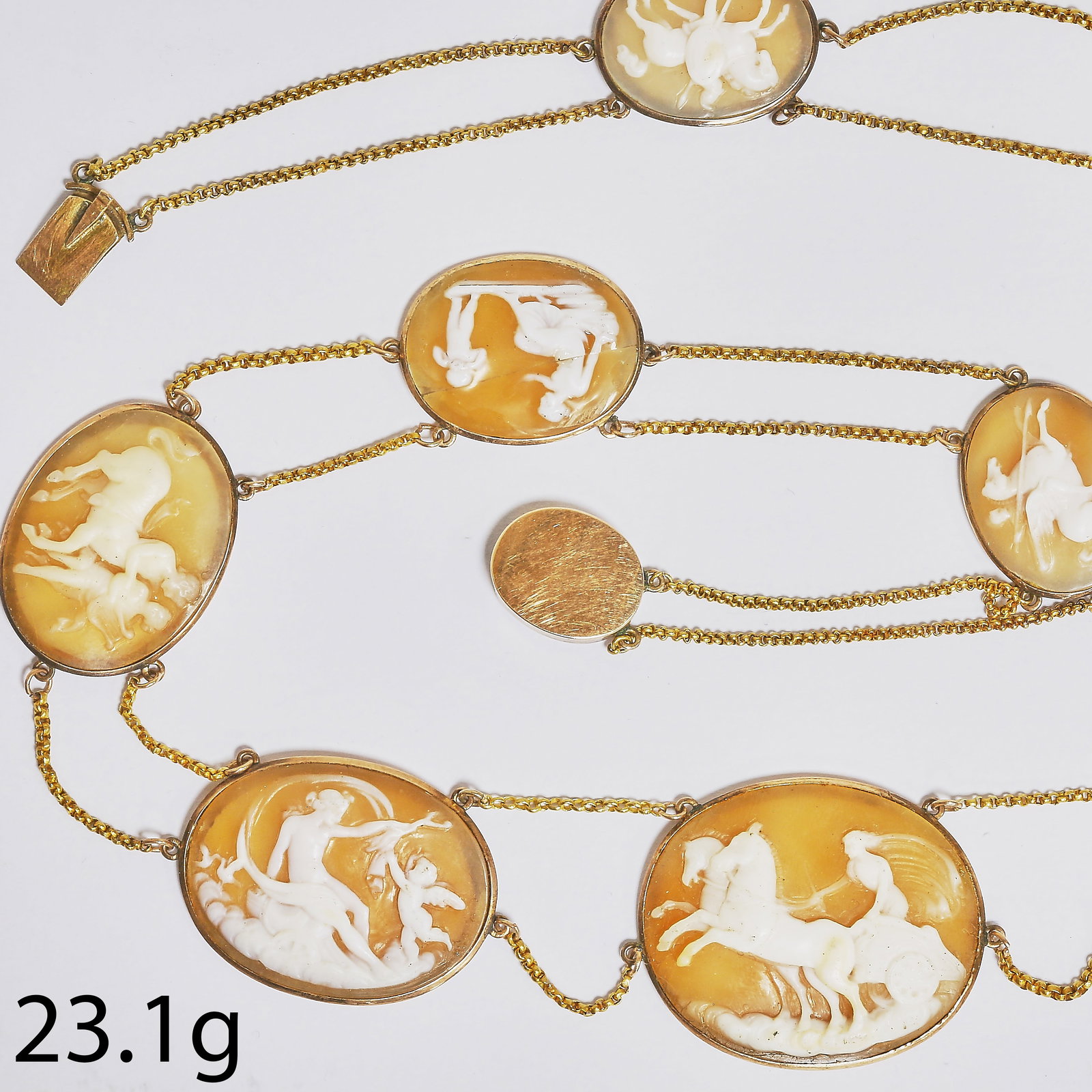 VICTORIAN SHELL CAMEL NECKLACE: VICTORIAN SHELL CAMEL NECKLACE,23.1 grams, testing high carat gold.Fine set with 9 carved cameo's depicting classical scenes.L. 46 cm.