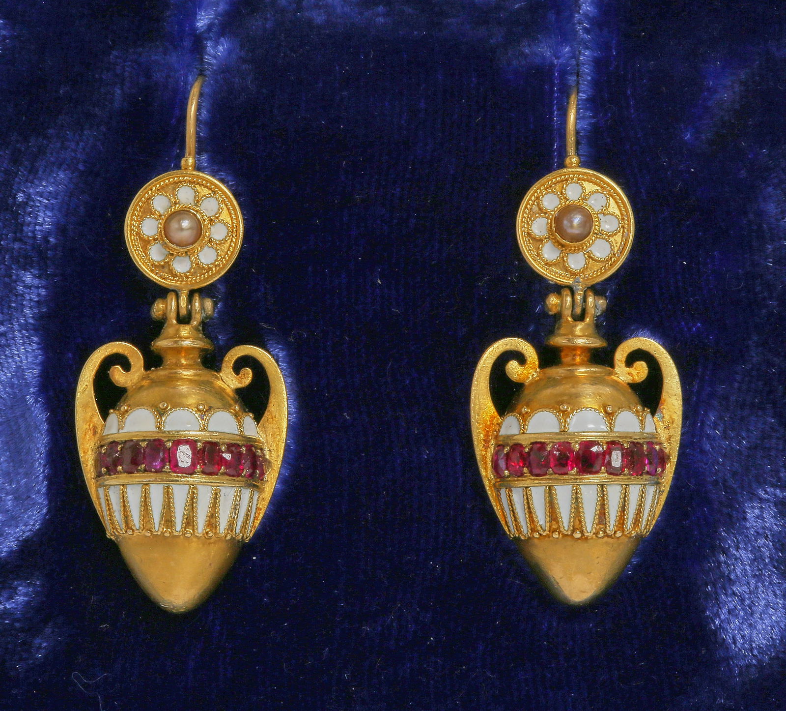 CARLO GIULIANO VICTORIAN RUBY, ENAMEL AND PEARL ETRUSCAN REVIVAL EARRINGS: CARLO GIULIANO VICTORIAN RUBY, ENAMEL AND PEARL ETRUSCAN REVIVAL EARRINGS. 8.9 grams, high carat gold.The earrings of Etruscan revival design depicting an amphora vase.Each set with 9 rubies, and whit