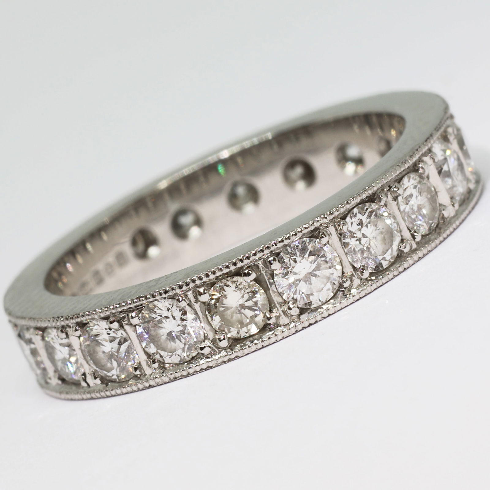 DIAMOND ETERNITY RING: DIAMOND ETERNITY RING,7.1 grams, platinum.Bright and lively diamonds, totalling approx. 2 ct.Size M.