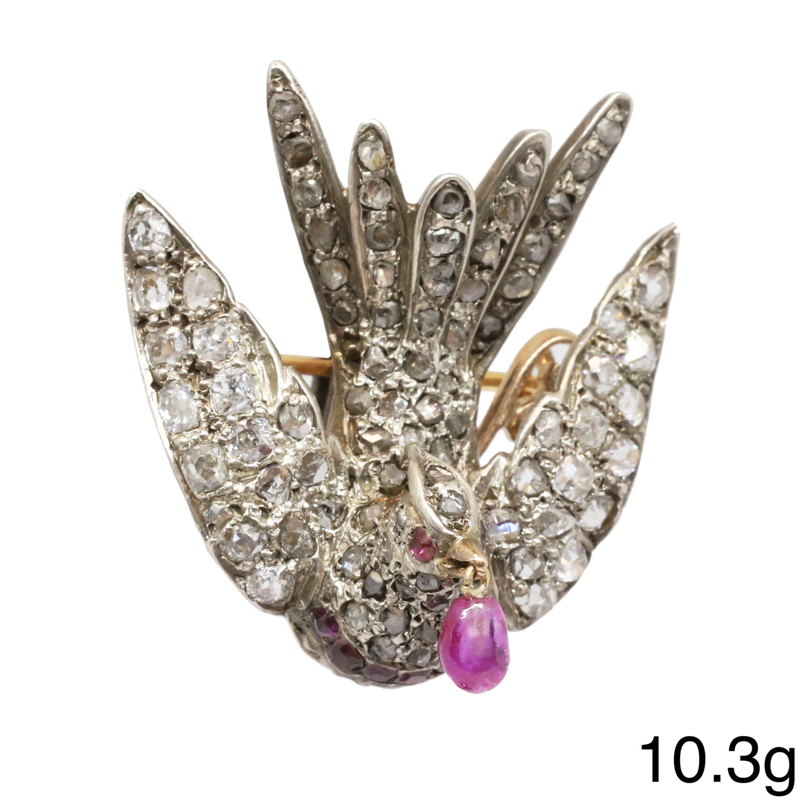 FINE VICTORIAN DIAMOND AND RUBY BIRD BROOCH: FINE VICTORIAN DIAMOND AND RUBY BIRD BROOCH,10.3 grams.Bright and lively diamonds, totalling approx. 2.20 ct.The bird of fine 3 dimensional design.Suspending a ruby drop from it's beak.W. 2.7 cm.