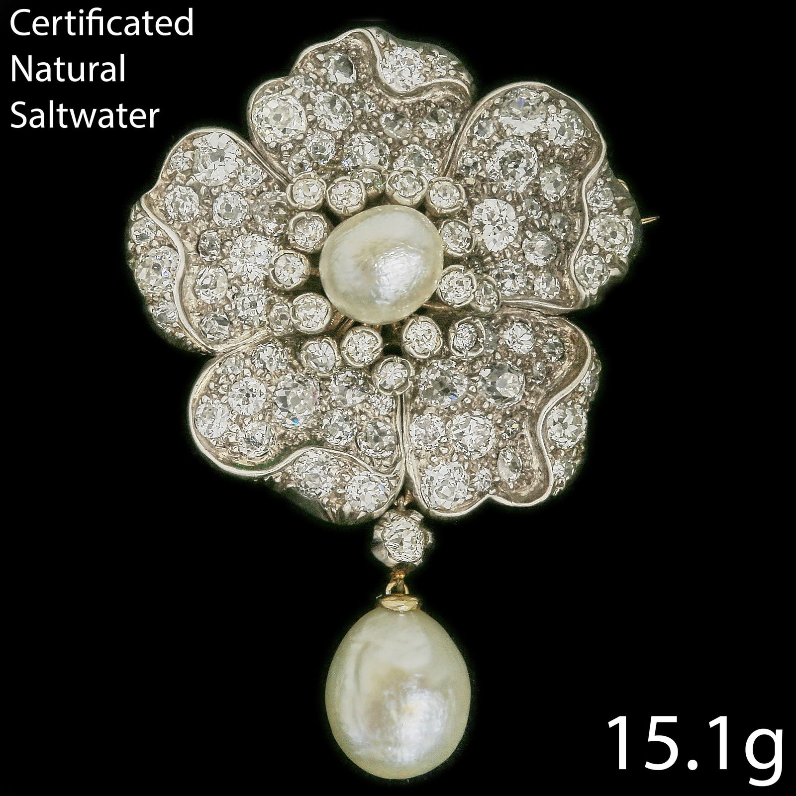 ANTIQUE CERTIFICATED NATURAL SALTWATER PEARL AND DIAMOND FLORAL BROOCH: ANTIQUE CERTIFICATED NATURAL SALTWATER PEARL AND DIAMOND FLORAL BROOCH,15 grams.Set with 2 large natural saltwater pearls, largest of approx. 11.5 mm. Respectively 4.91 and 4.86 ct. (Certificated, Nat