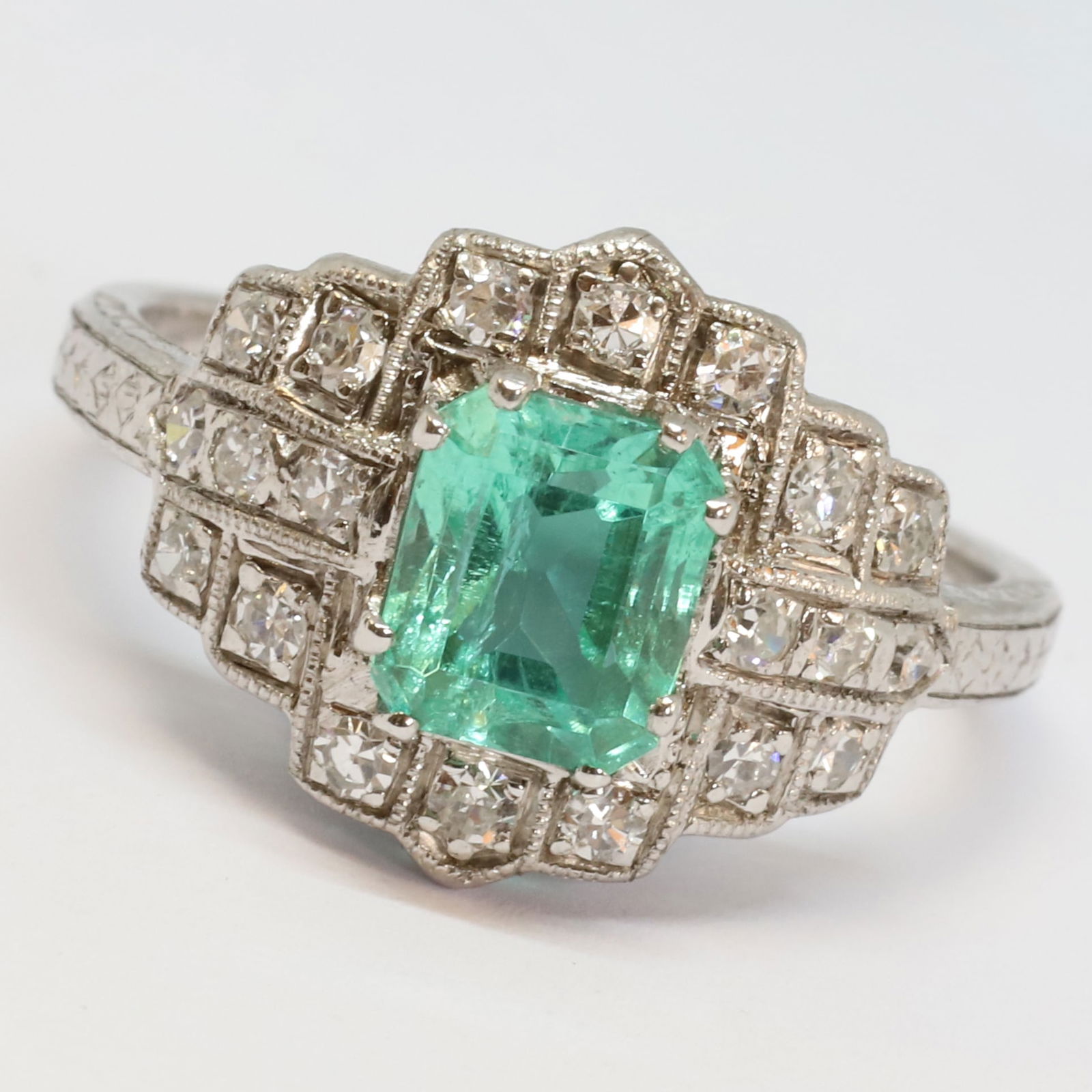 ANTIQUE EMERALD AND DIAMOND CLUSTER RING: ANTIQUE EMERALD AND DIAMOND CLUSTER RING 5.5 grams platinum Fine emerald with good clarity. (likely Colombian).bright lively diamonds in excellent condition size N