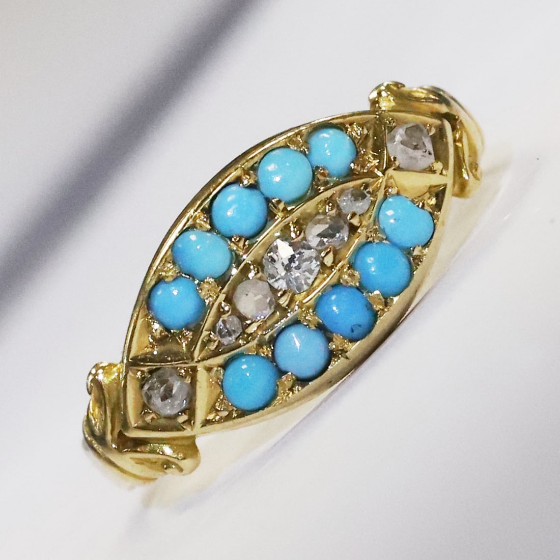 VICTORIAN TURQUOISE AND DIAMOND RING: VICTORIAN TURQUOISE AND DIAMOND RING,Testing high carat gold.Lovely vibrant turquoise.Bright and lively diamonds.Size L 1/2.