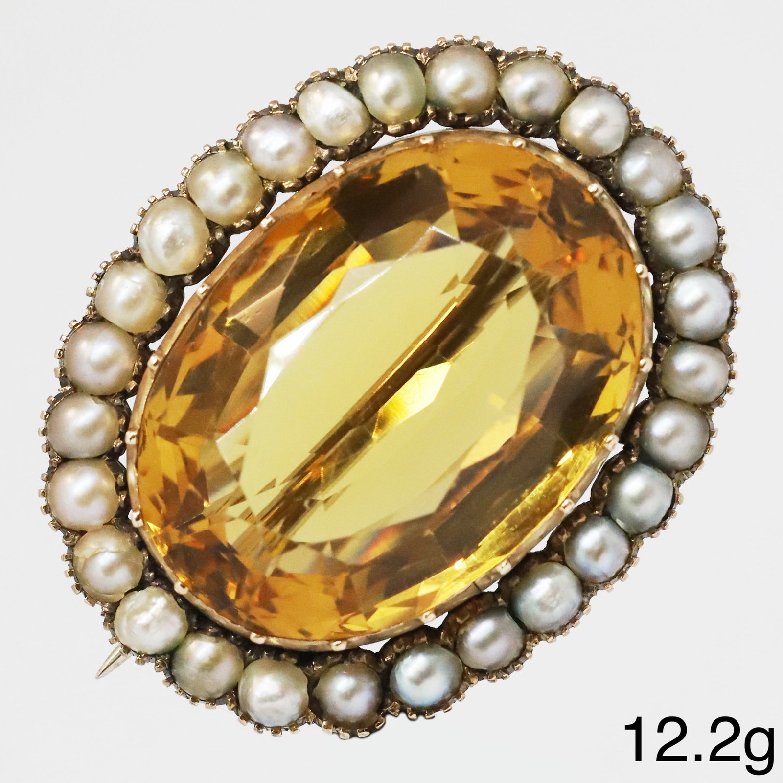VICTORIAN CITRINE AND PEARL GOLD BROOCH: VICTORIAN CITRINE AND PEARL GOLD BROOCH,12.2 grams.Rich and vibrant citrine of approx. 24.4 mm.W. 33 mm.
