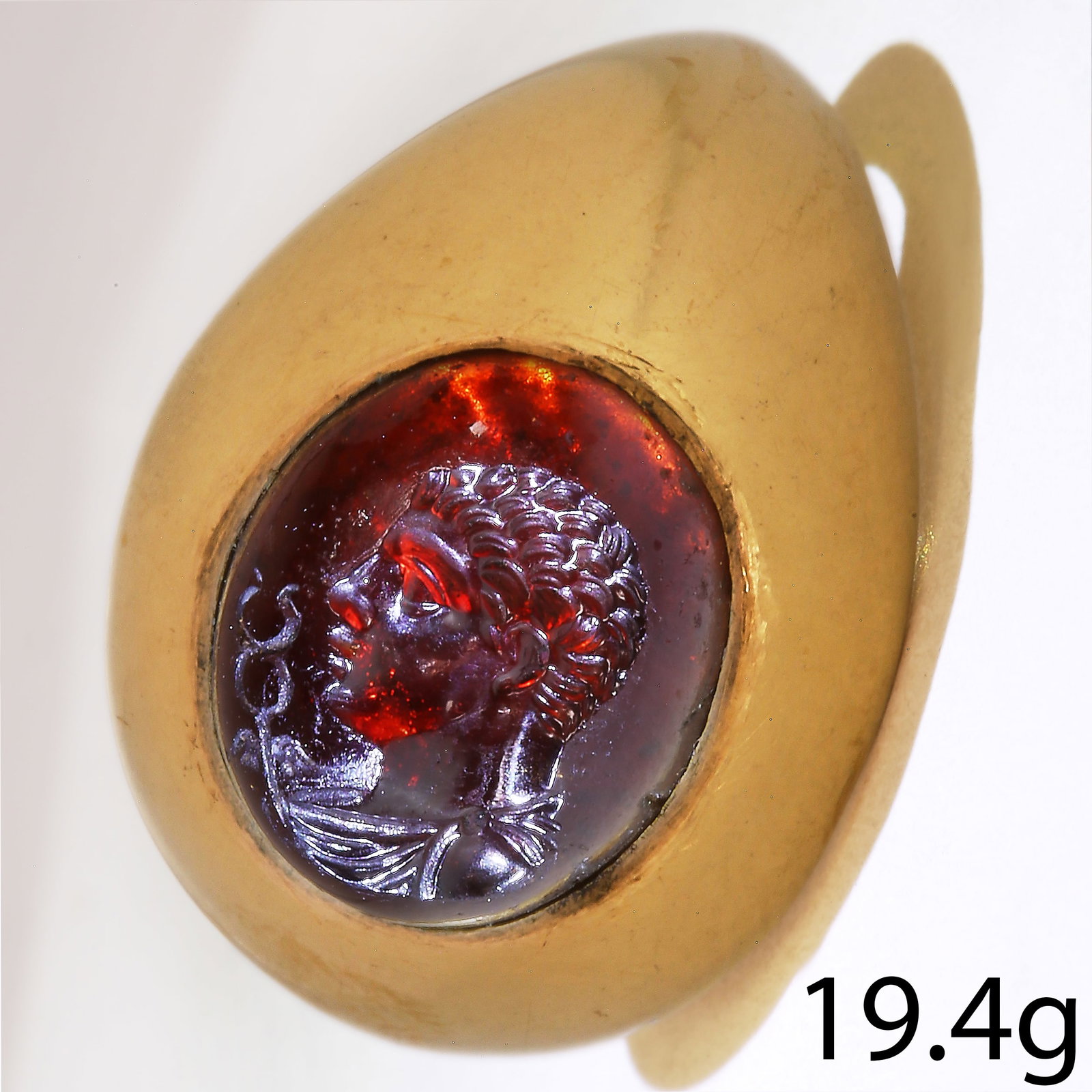 ROMAN CARVED GARNET INTAGLIO RING: ROMAN CARVED GARNET INTAGLIO RING19.4 grams, high carat gold.The carved garnet intaglio presumed to depict Hermes.Size: N.- This lot has been check against the Art loss Register and cleared.