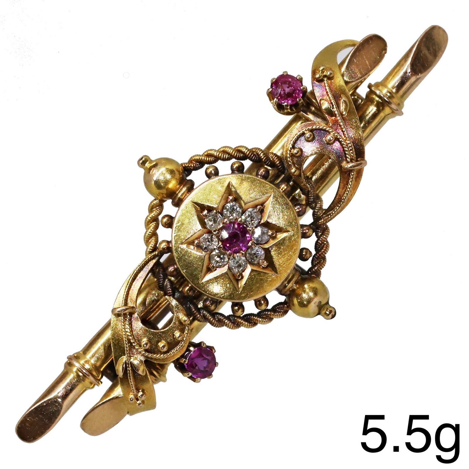 VICTORIAN RUBY AND DIAMOND BROOCH: VICTORIAN RUBY AND DIAMOND BROOCH,5.5 grams, 15 ct. gold.Diamonds bright and lively.W. 4.8 cm.