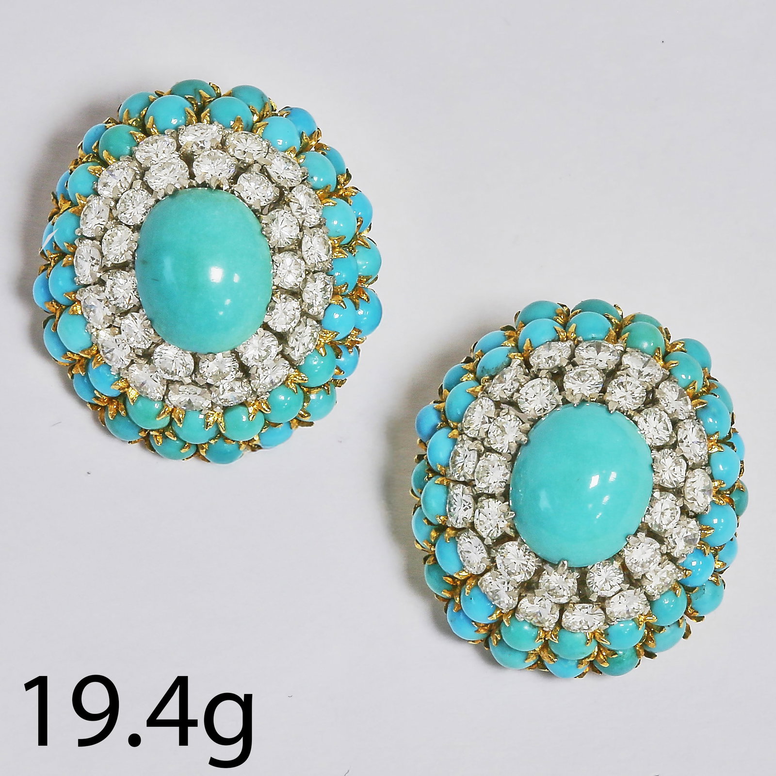 PAIR OF TURQUOISE AND DIAMOND CLUSTER EARRINGS: PAIR OF TURQUOISE AND DIAMOND CLUSTER EARRINGS,19.4 grams, testing high carat gold.Rich and vibrant turquoise.Diamonds bright and lively, totalling approx. 2.50 ct.L. 2.3 cm.