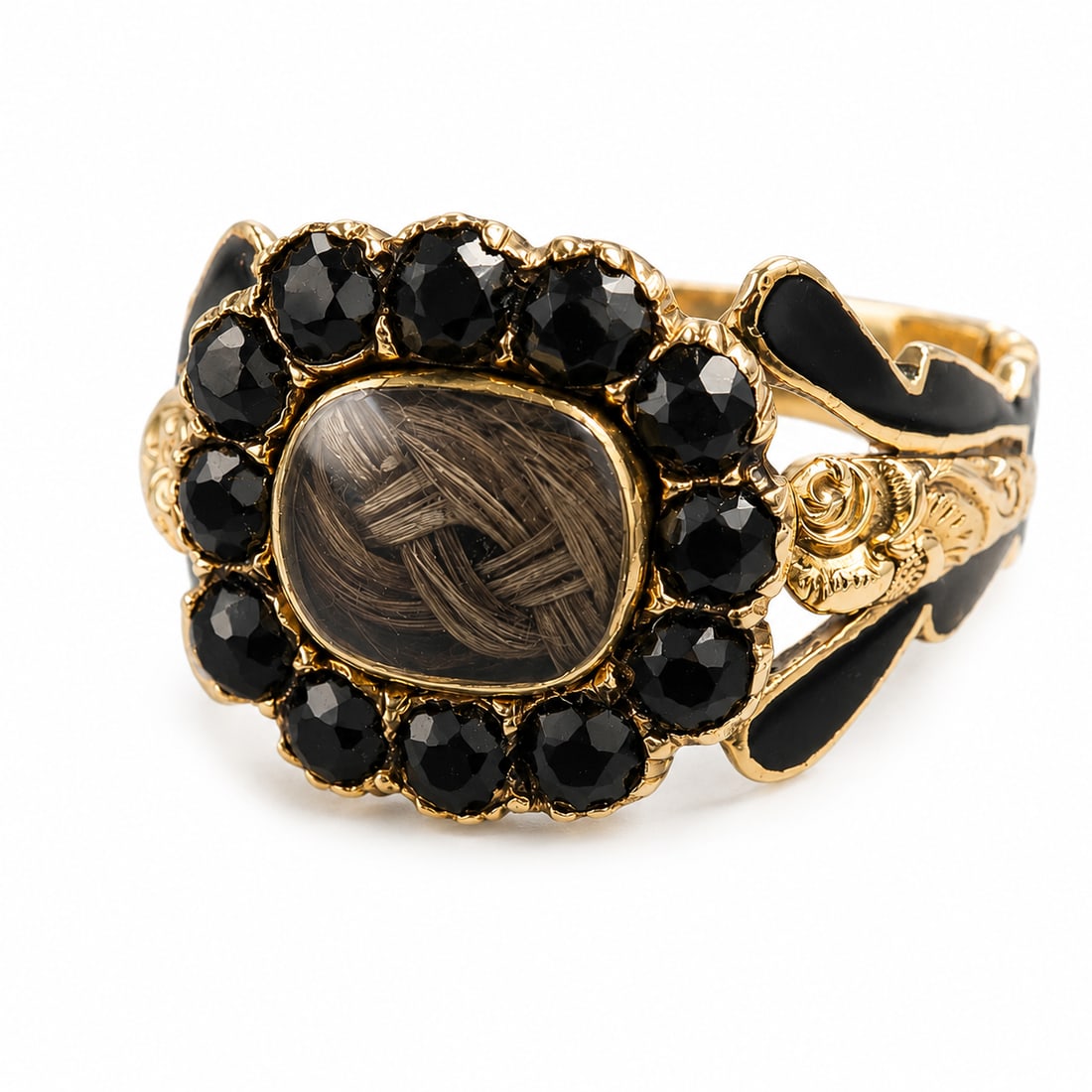 GEORGIAN ENAMEL AND JET RING: GEORGIAN ENAMEL AND JET RING,3,7 grams, 18 ct. gold.The centre with a locket surrounded by jet.Part black enamel on the shoulders.Size N.