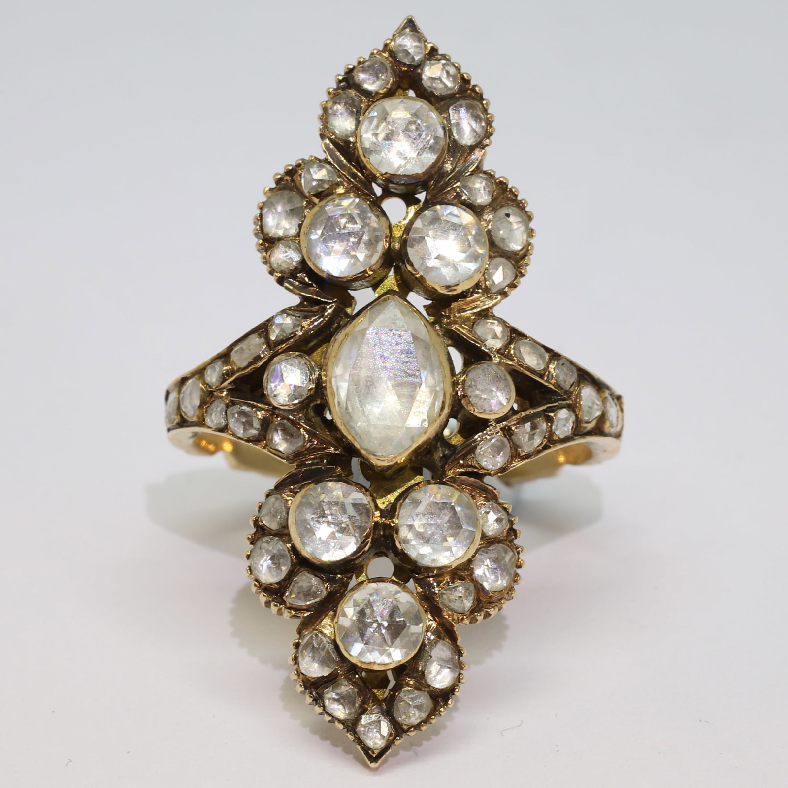 ANTIQUE DIAMOND NAVETTE SHAPED RING: ANTIQUE DIAMOND NAVETTE SHAPED RING,8,4 grams, testing high carat gold.Bright and lively diamonds.head L. 3.3 cm.Size K 1/2.