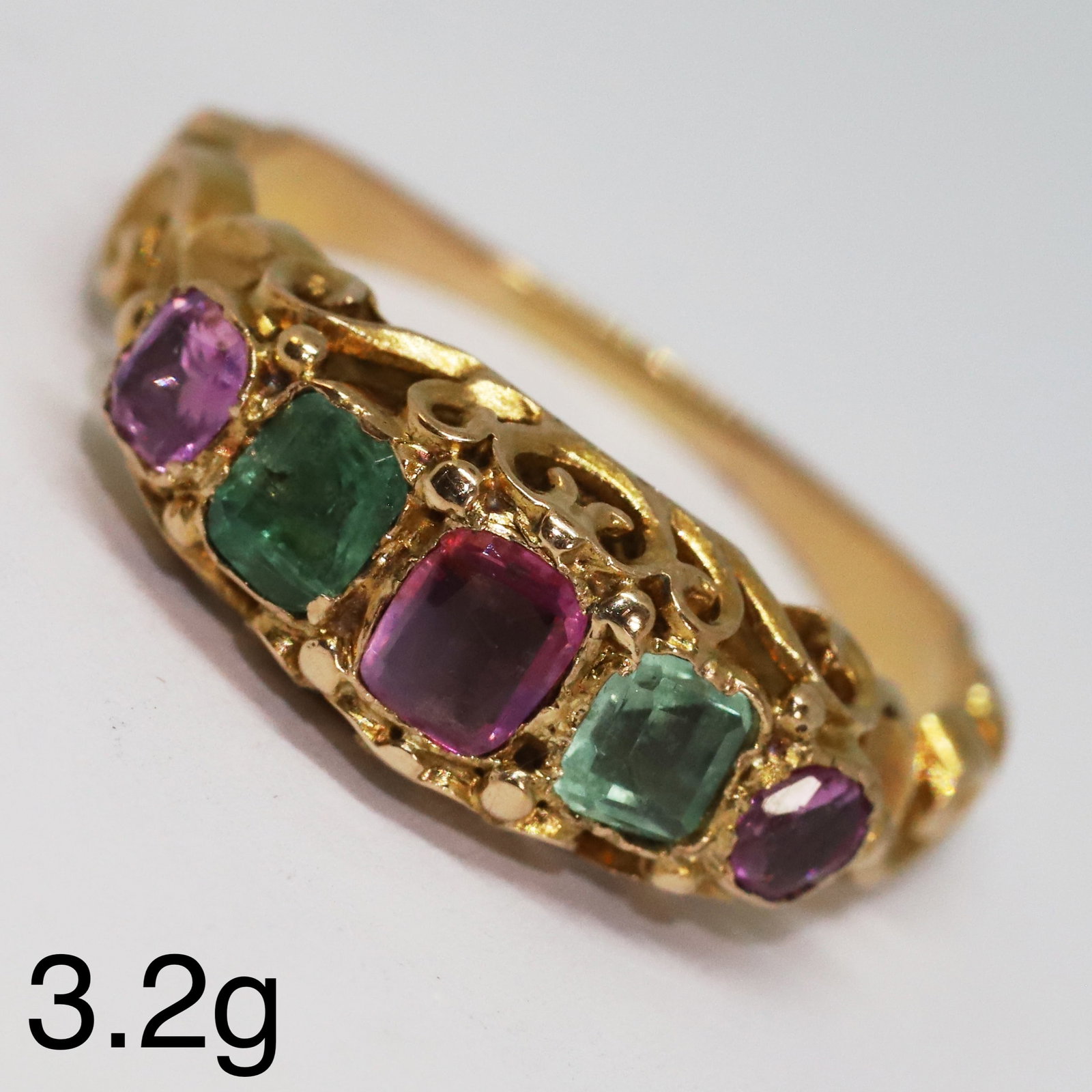 LOVELY GEORGIAN EMERALD AND RUBY 5-STONE RING: LOVELY GEORGIAN EMERALD AND RUBY 5-STONE RING,3,2 grams, testing high carat gold.Lovely rubies and emeralds.Unusual design.Size O 1/2.