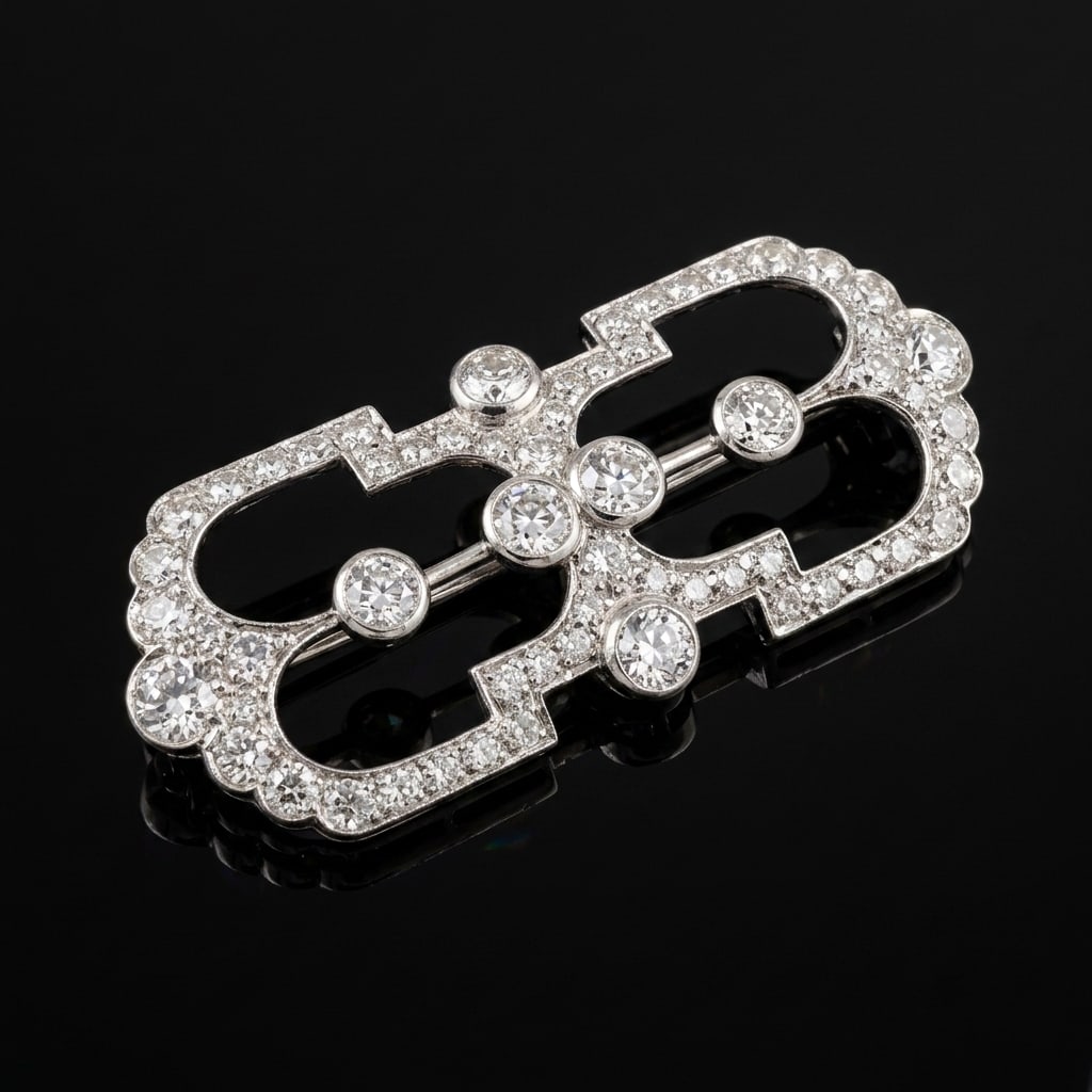 ART-DECO DIAMOND BROOCH: ART-DECO DIAMOND BROOCH,8.6 grams, testing high carat gold.Diamonds bright and lively, totalling approx. 2.15 ct.W. 4.6 cm.